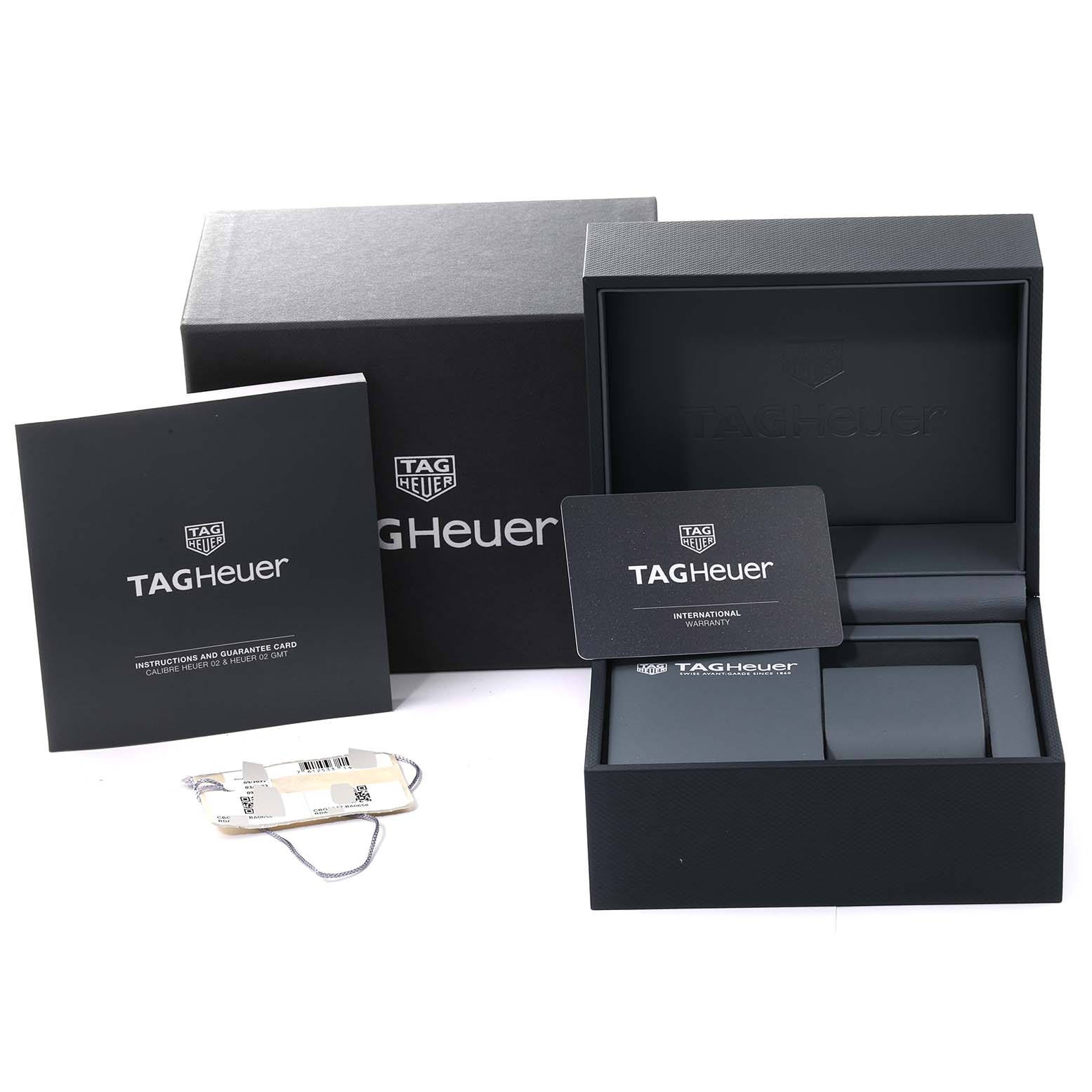 The image shows the packaging, instruction booklet, warranty card, and tags for a Tag Heuer Carrera CBG2A1Z.BA0658 Men
s Stainless Steel Black Dial CBG2A1Z.BA0658 Men
s Stainless Steel Black Dial watch.