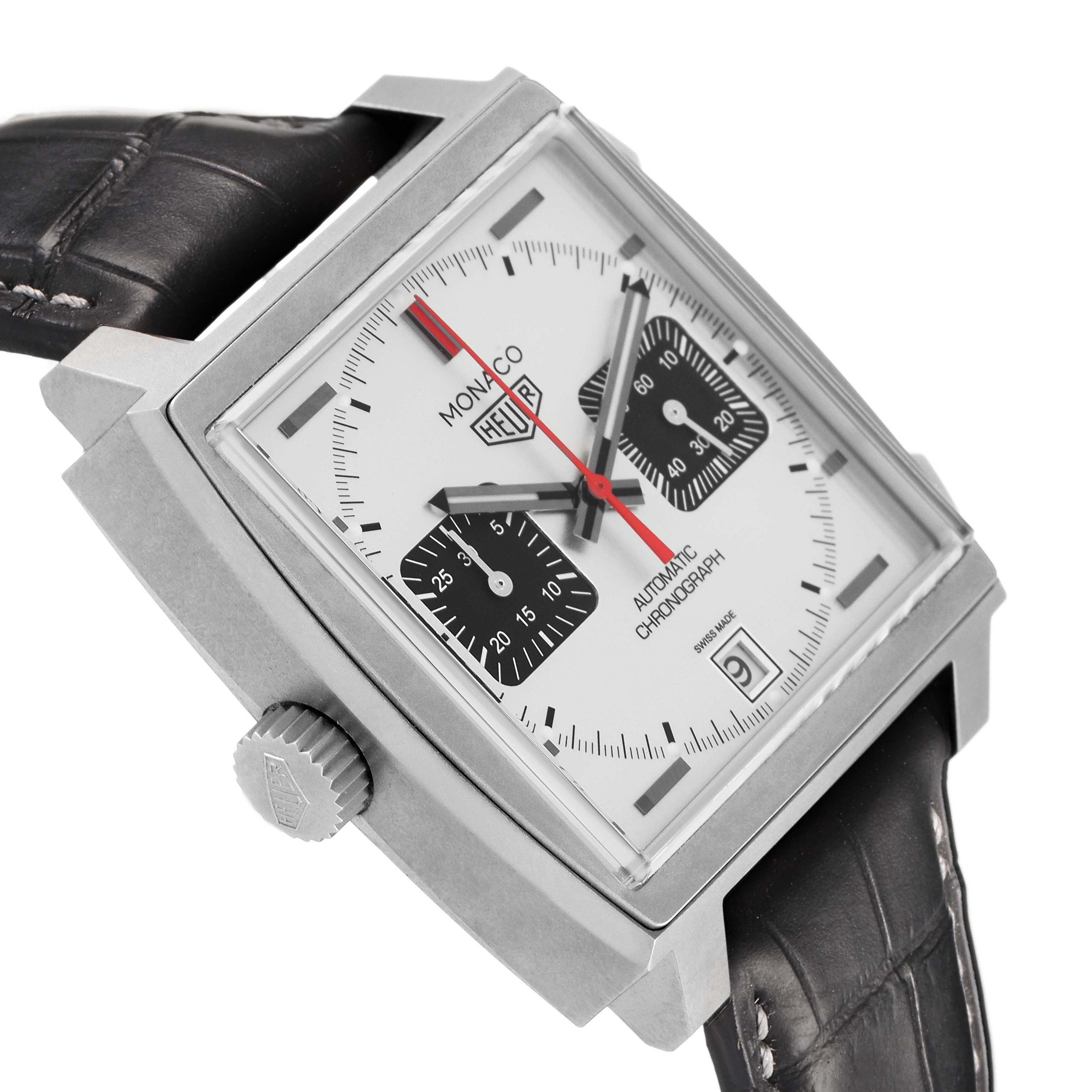 The image shows a Tag Heuer Monaco CAW218B.FC6496 Men's Titanium Silver Dial watch at a tilted angle, highlighting its square case, dial, crown, and leather strap.