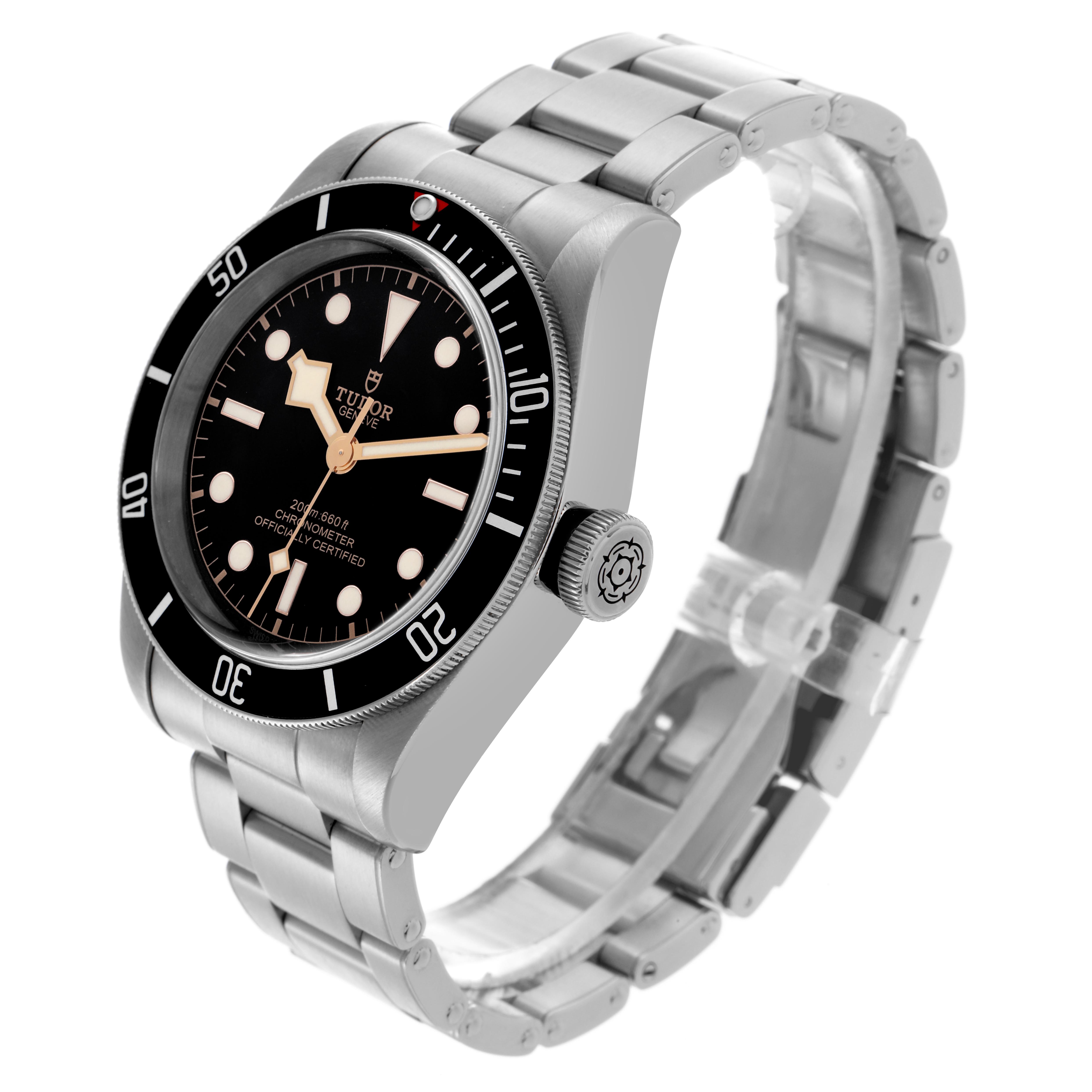The Heritage Black Bay by Tudor is shown at a three-quarter angle, highlighting the face, bezel, bracelet, and crown.