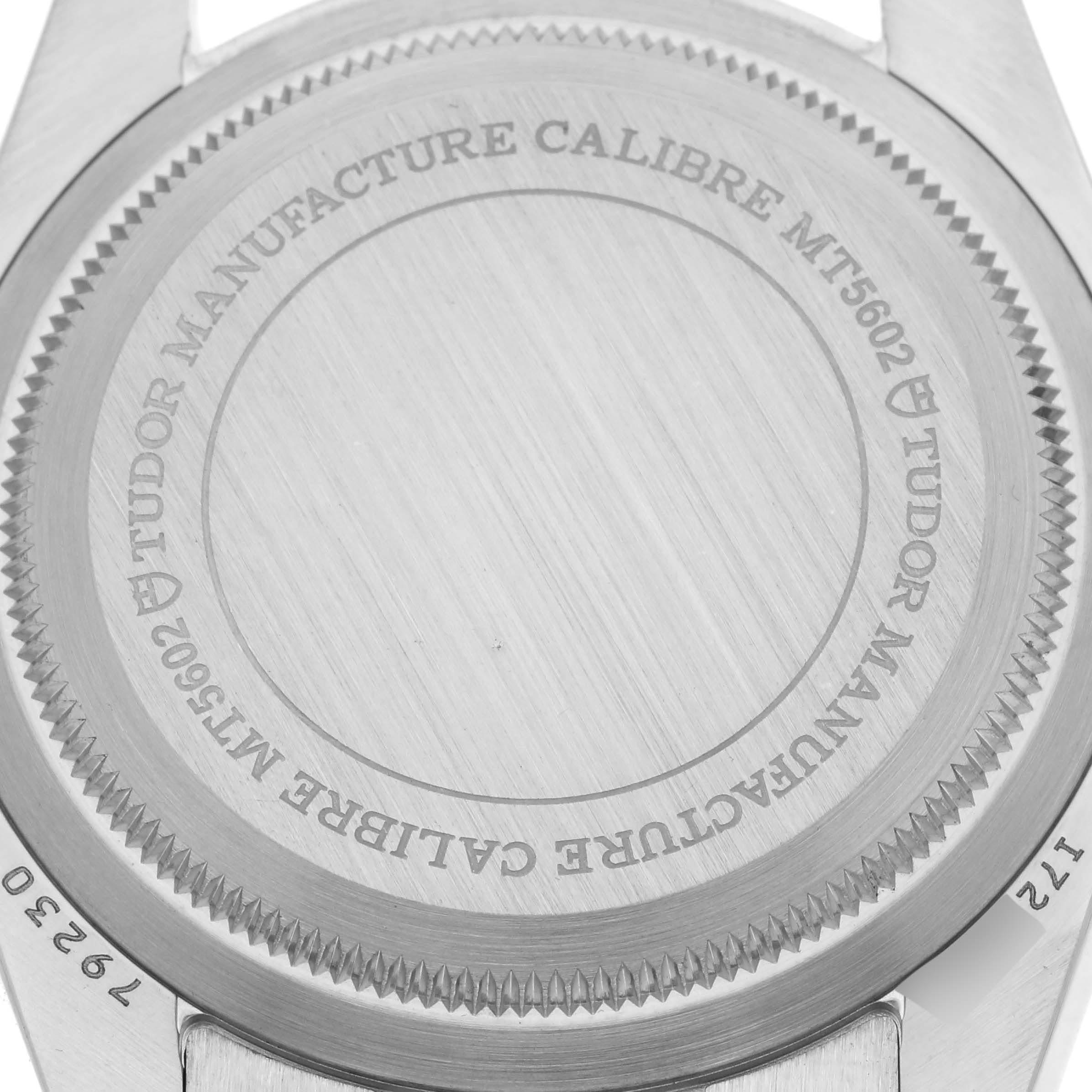 The image shows the back case of the Tudor Heritage Black Bay 79230N Men's Stainless Steel Black Dial 79230N Men's Stainless Steel Black Dial, featuring engraved details of the manufacture calibre.