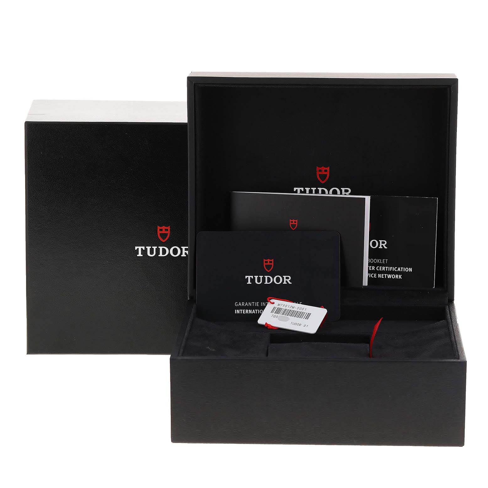 The image shows the packaging accessories for the Tudor Heritage Black Bay 79012 Men
s Bronze Brown Dial 79012 Men
s Bronze Brown Dial watch, including boxes, manuals, and cards, from a frontal angle.