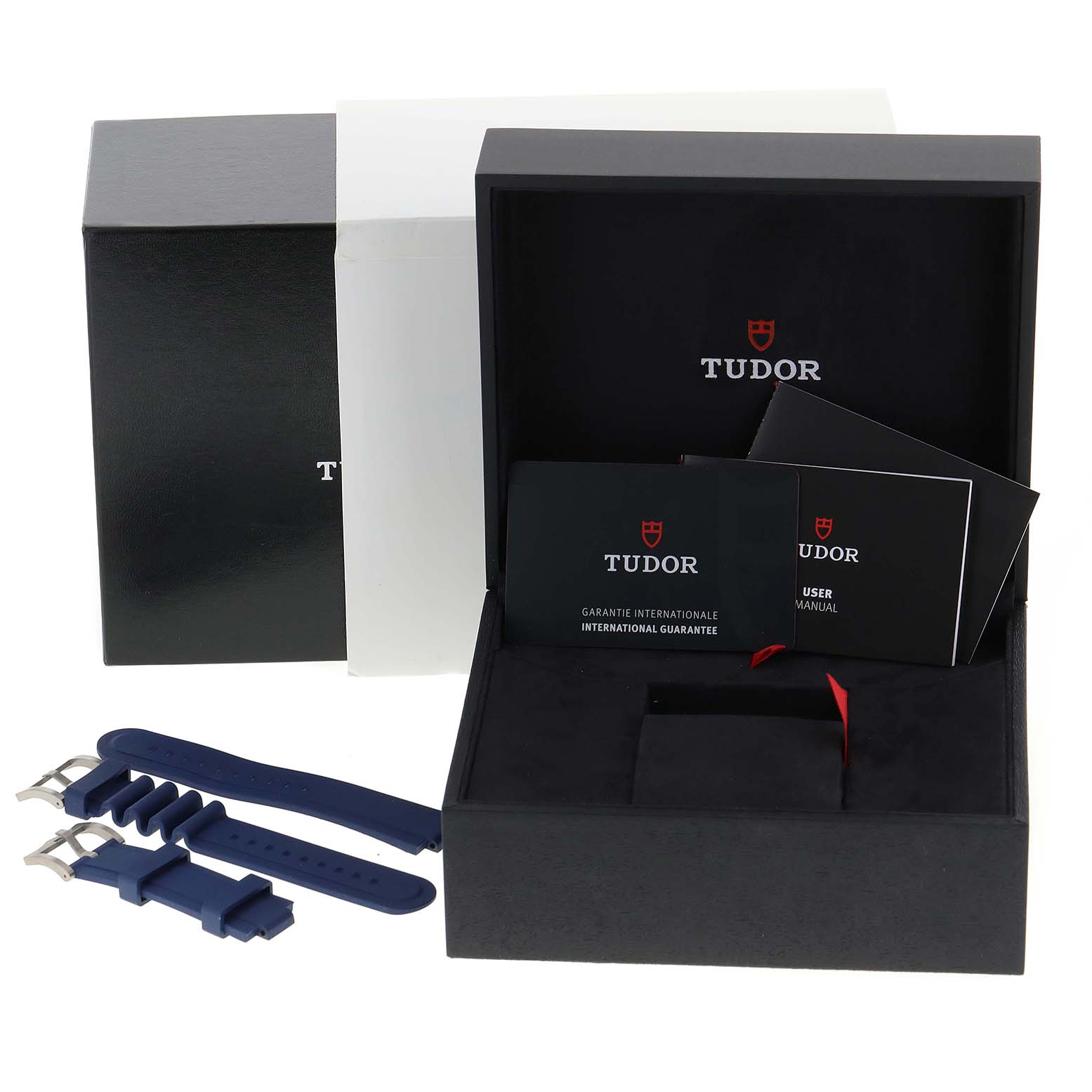 The Tudor Pelagos 25600TB Men's Titanium Blue Dial 25600TB Men's Titanium Blue Dial watch accessories include a box, manuals, warranty cards, and blue rubber straps.