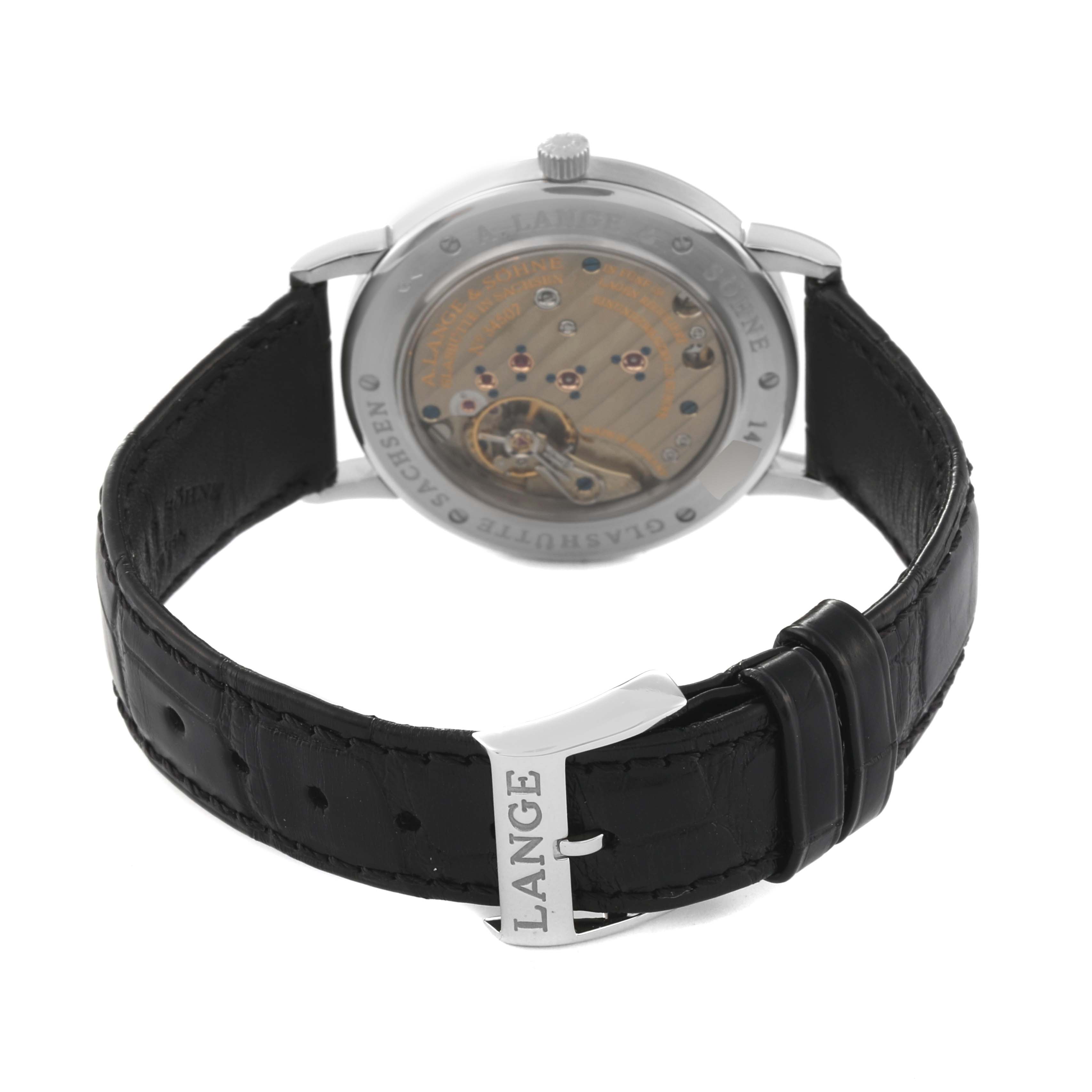 The image shows the back view of an 1815 model watch by A. Lange & Sohne, including its leather strap and buckle.