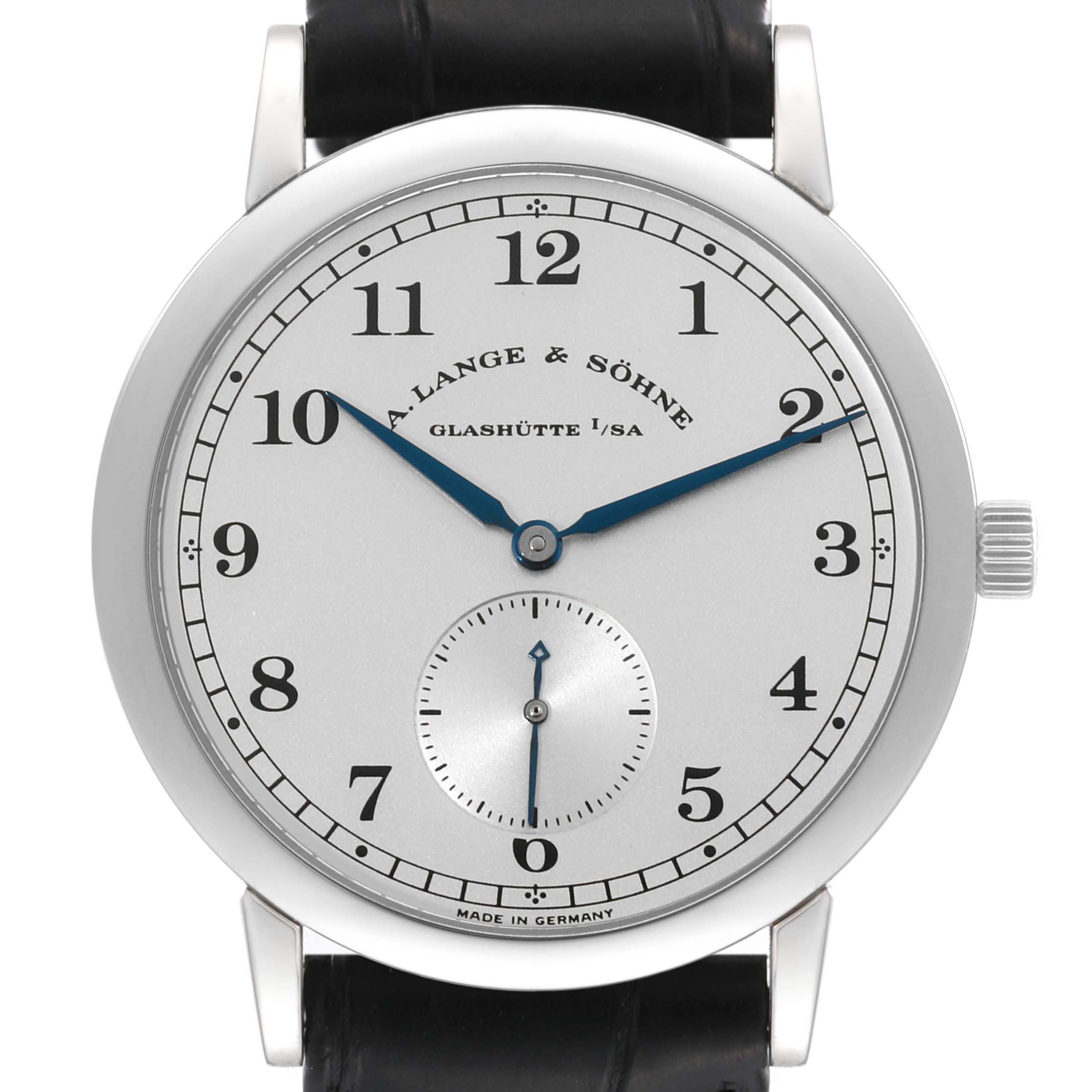 The image shows a front view of the 1815 model by A. Lange & Söhne, featuring the dial, hour markers, and hands.