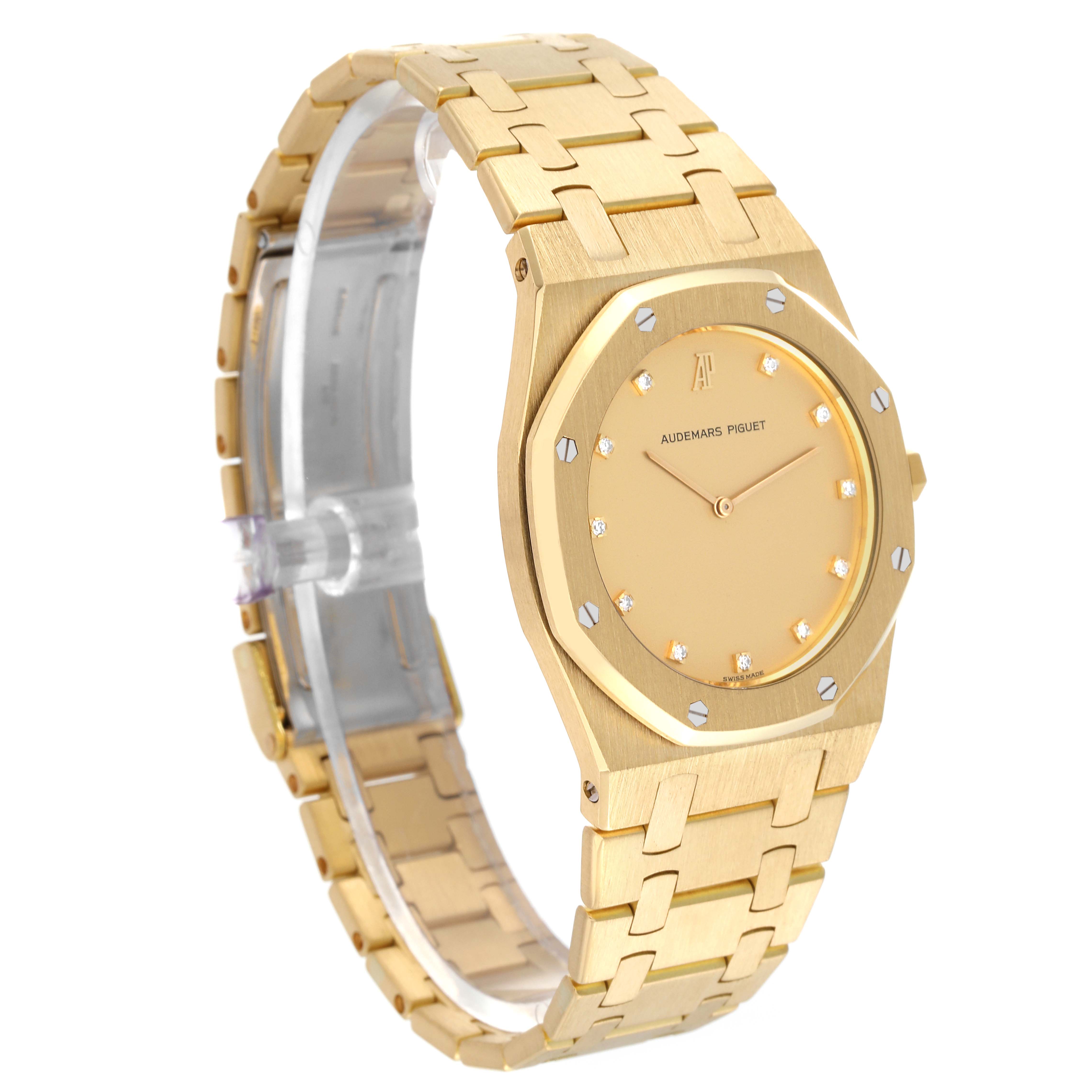 This image shows the Audemars Piguet Royal Oak Men's Yellow Gold Champagne Dial Men's Yellow Gold Champagne Dial watch from a three-quarter angle, displaying the face and part of the bracelet.