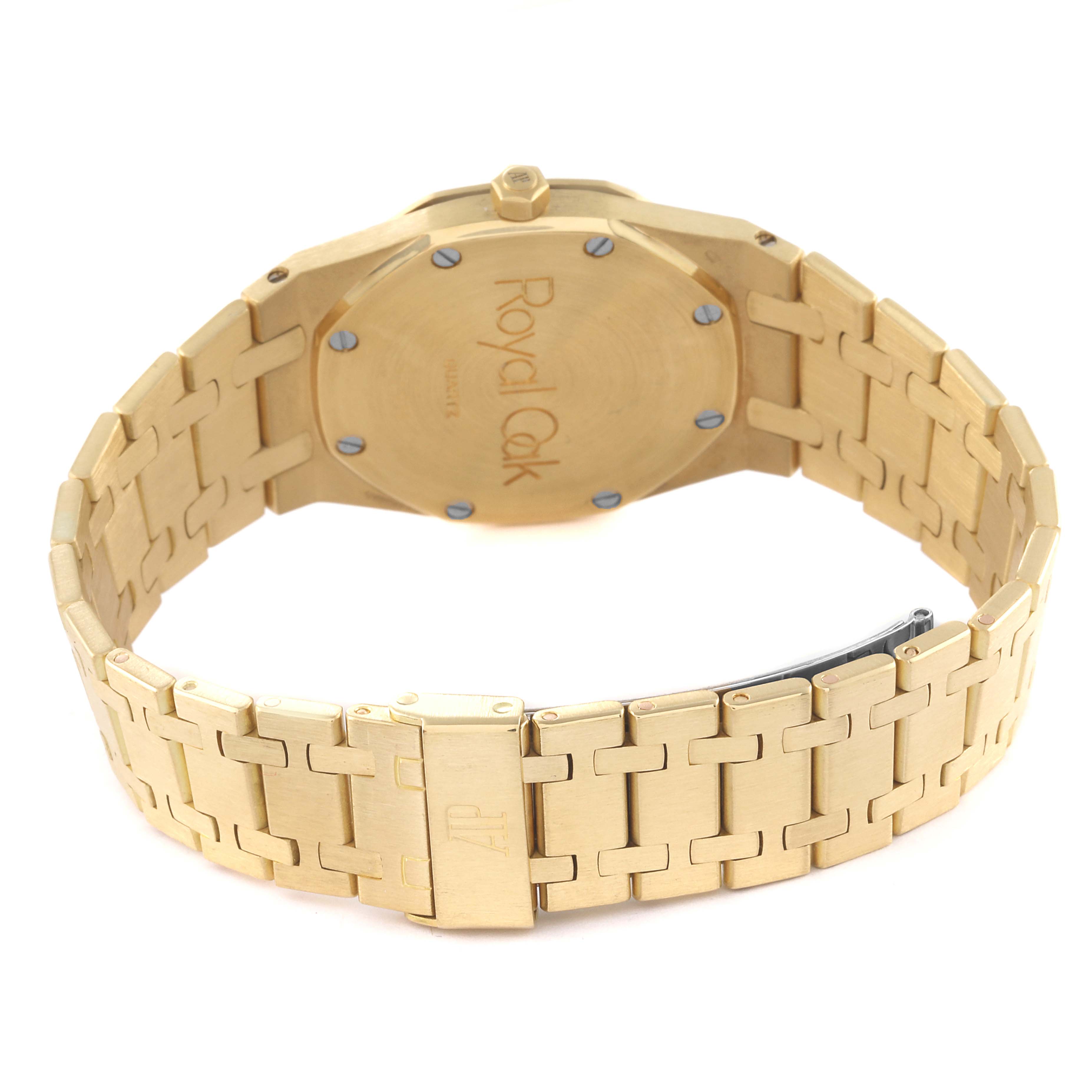 The image shows the back view of an Audemars Piguet Royal Oak Men's Yellow Gold Champagne Dial Men's Yellow Gold Champagne Dial watch, highlighting its case back and bracelet.