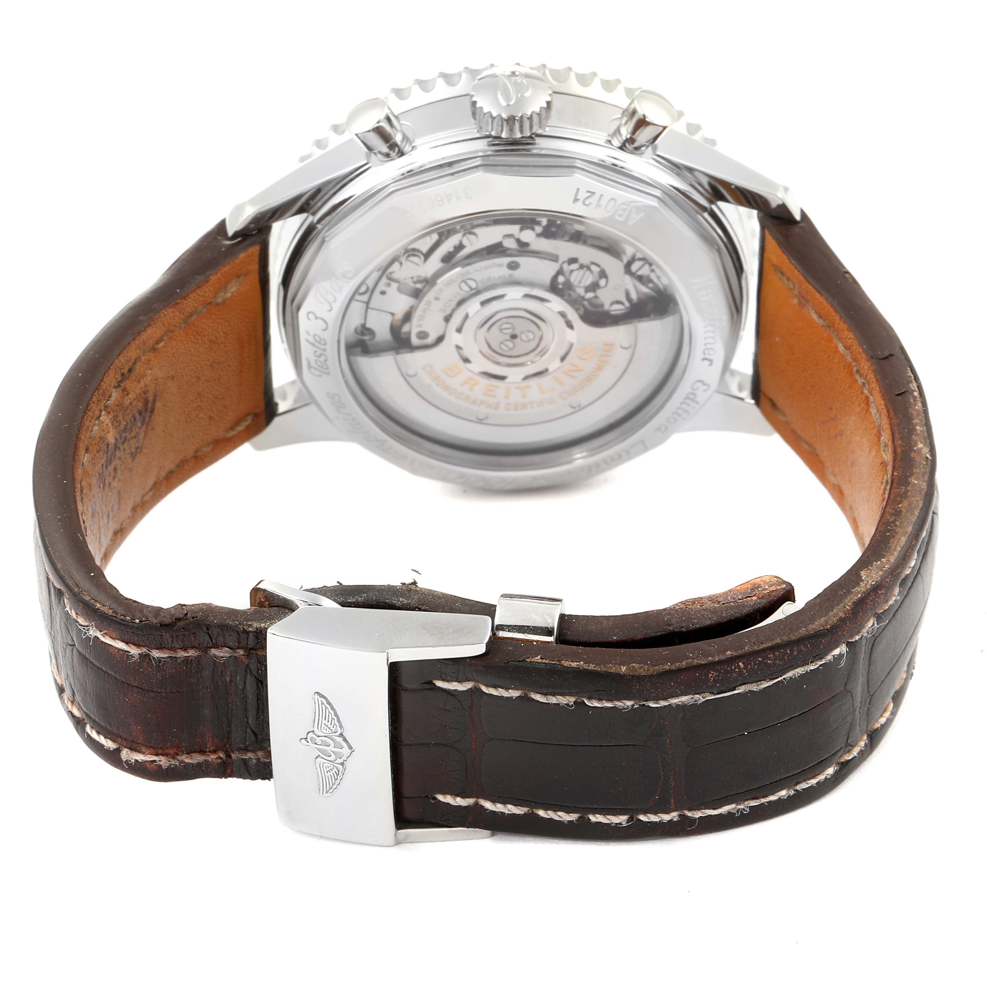 The image shows the back view of a Breitling Navitimer AB0121C4-Q605-739P-A20BA.1 Men's Stainless Steel Brown Dial AB0121C4-Q605-739P-A20BA.1 Men's Stainless Steel Brown Dial watch, highlighting its leather strap and exposed movement.