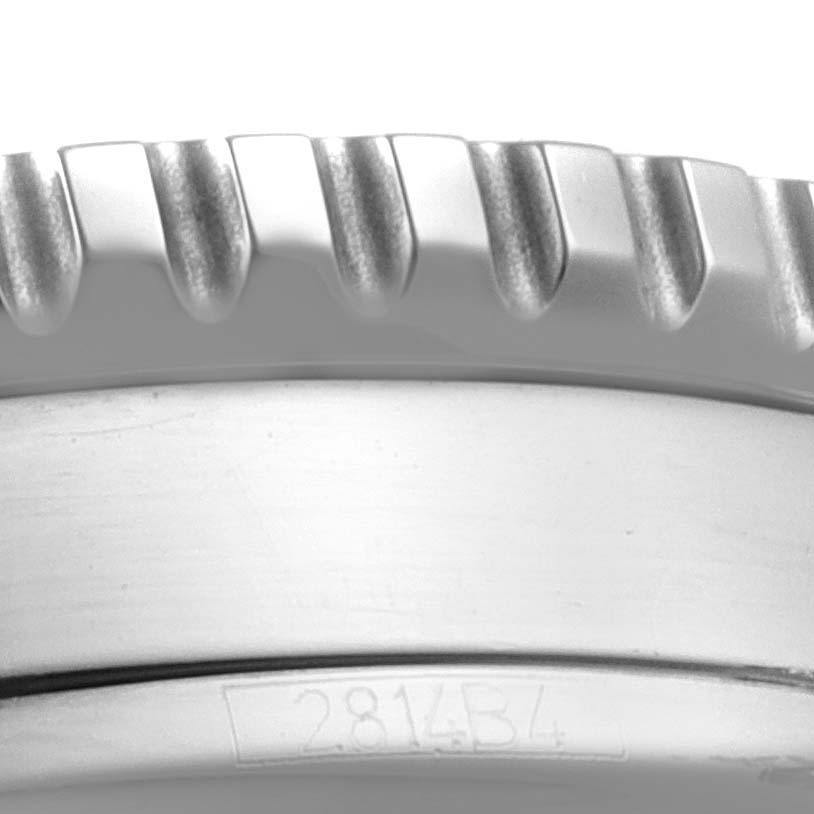 The image shows a close-up of the bezel and part of the case with an engraving from a Breitling Navitimer A13324 Men's Stainless Steel Silver Dial A13324 Men's Stainless Steel Silver Dial watch.