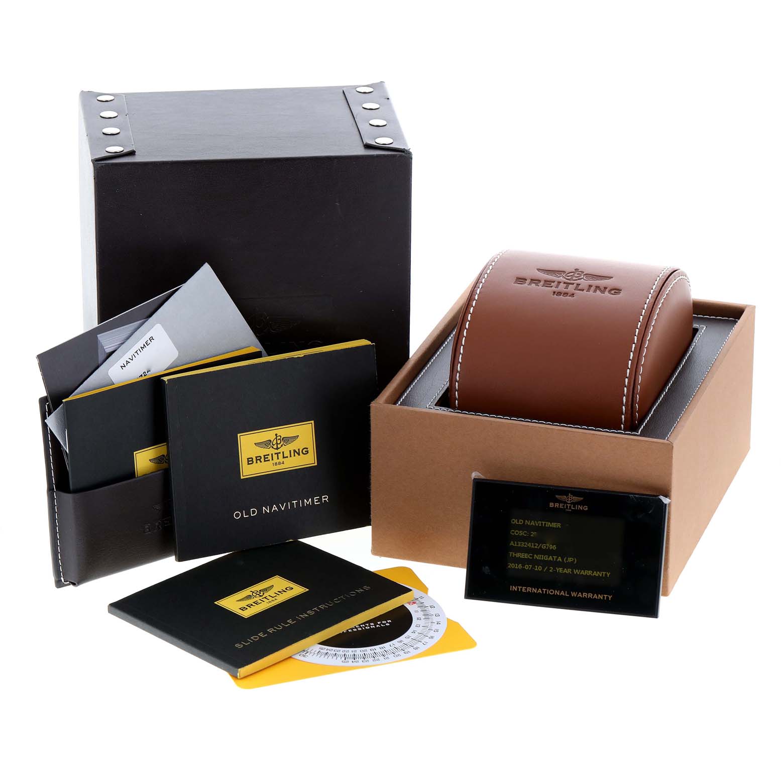 The image shows a Breitling Navitimer A13324 Men's Stainless Steel Silver Dial A13324 Men's Stainless Steel Silver Dial watch box, leather case, instruction manuals, and warranty cards from a front angle.