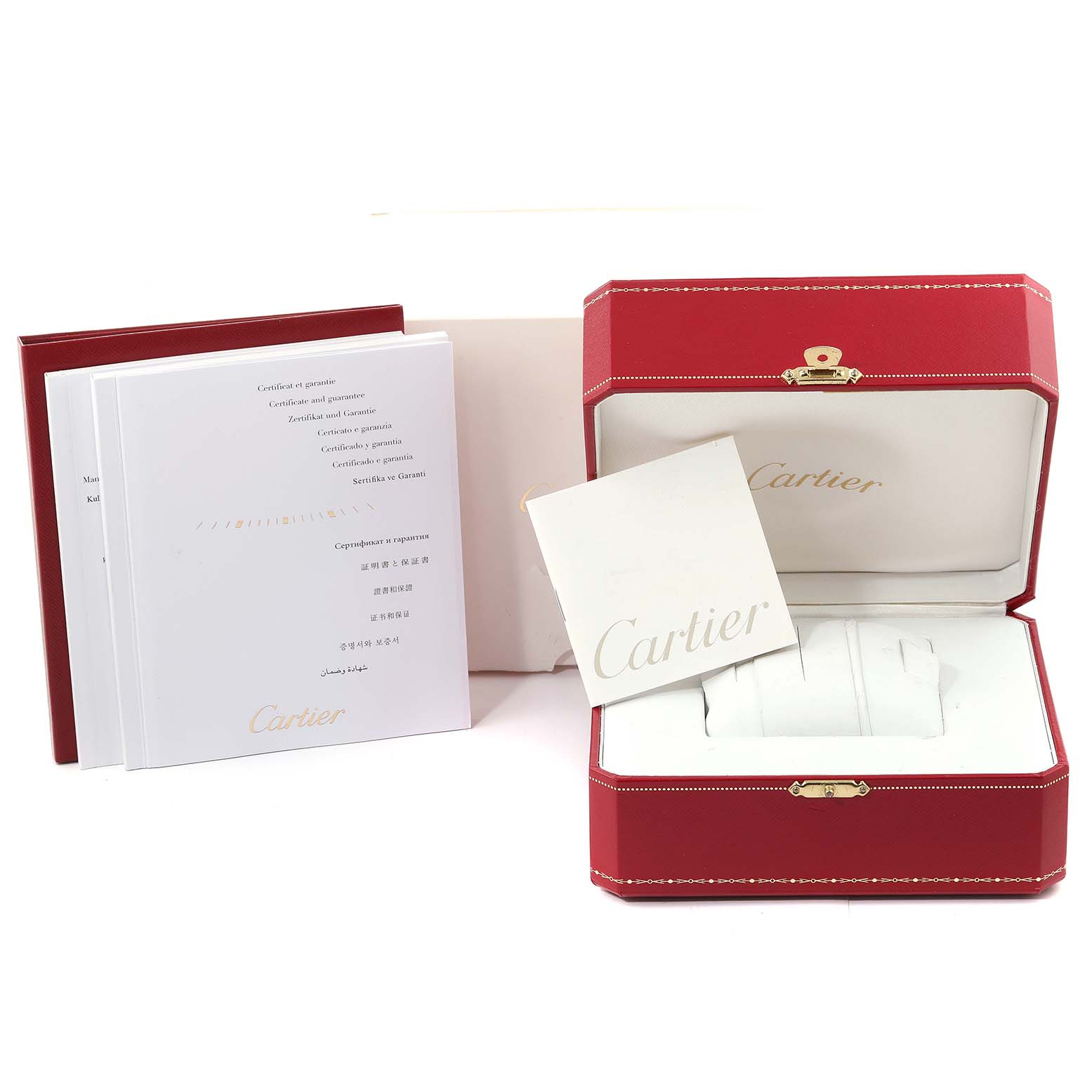 The image shows the box, manuals, and certificates for a Calibre de Cartier watch by Cartier.