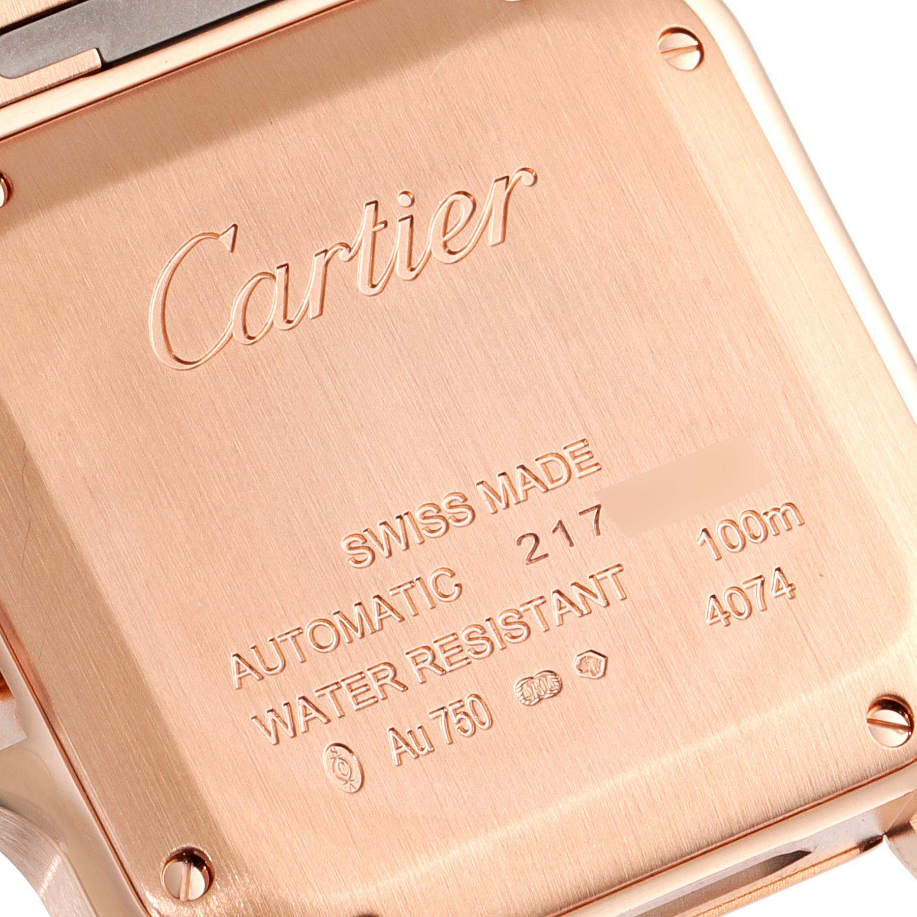 This image shows the case back of a Cartier Santos WGSA0008 Men's Rose Gold Silver Dial WGSA0008 Men's Rose Gold Silver Dial watch, highlighting brand engraving and specifications.
