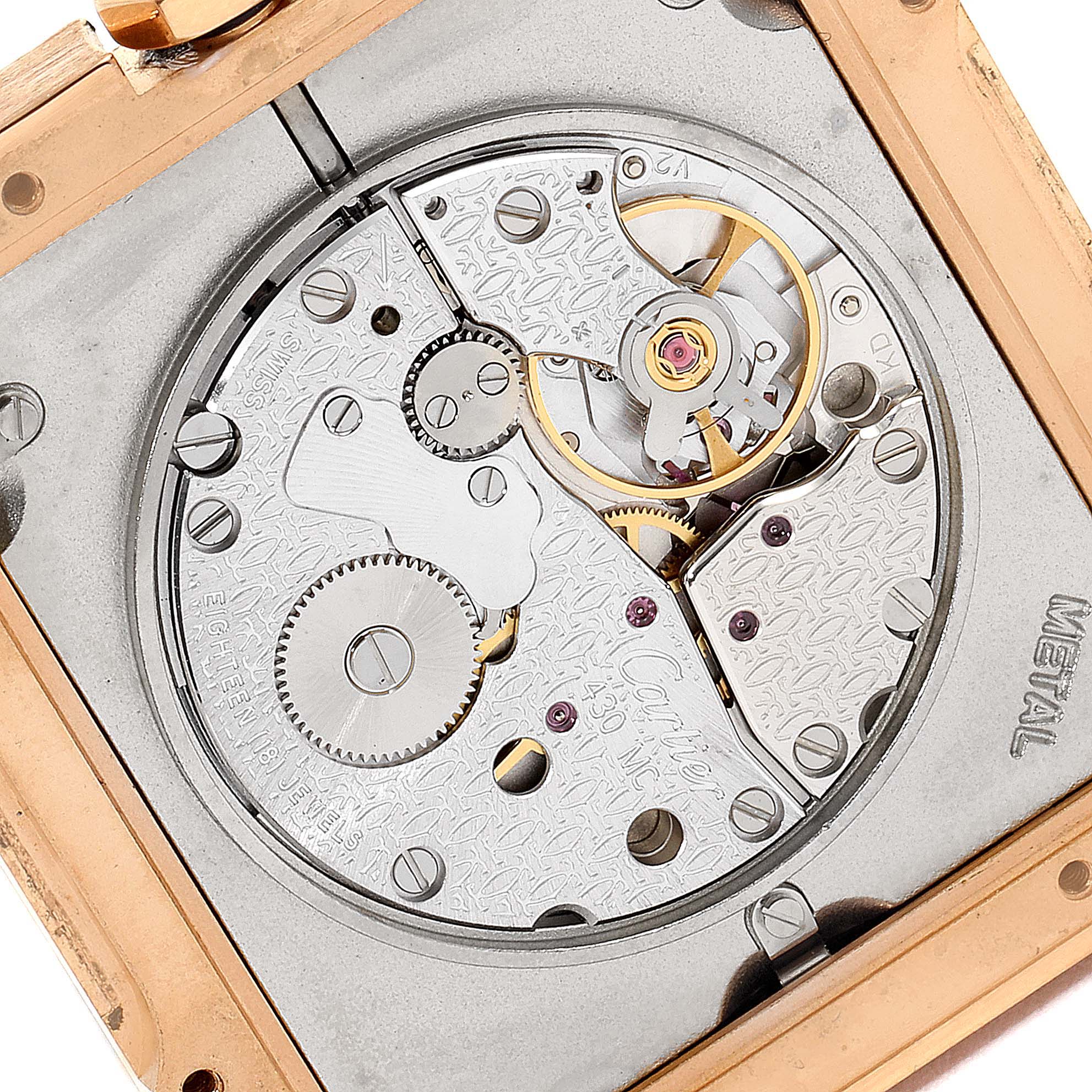 This image shows the back movement mechanism of the Cartier Santos Dumont W2006951 Men's Rose Gold Silver Dial W2006951 Men's Rose Gold Silver Dial watch, viewed at an angle that reveals internal gears and components.