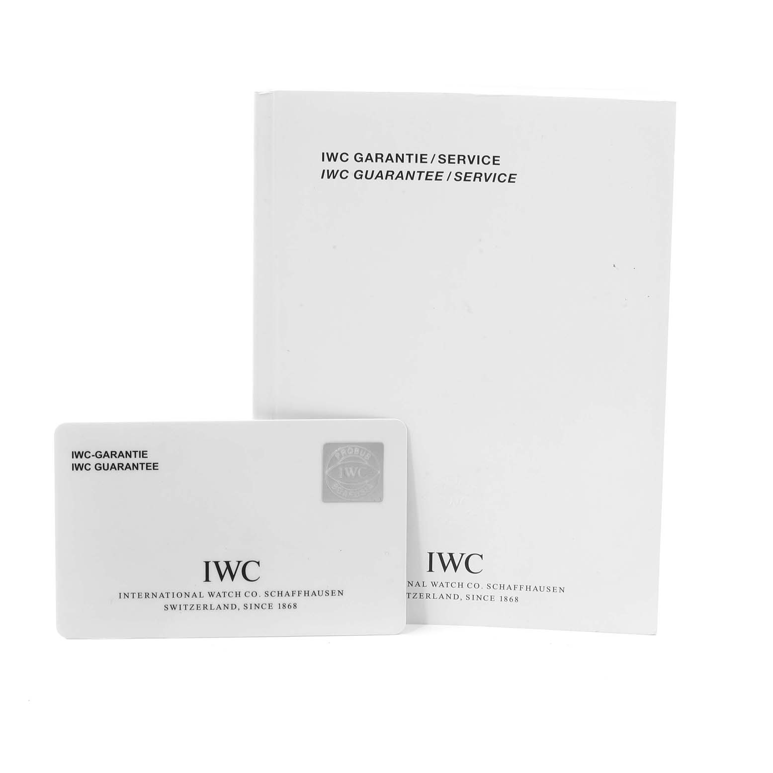 The image shows the IWC Pilot IW325301 Men's Stainless Steel Black Dial IW325301 Men's Stainless Steel Black Dial watch's guarantee card and service manual placed upright.