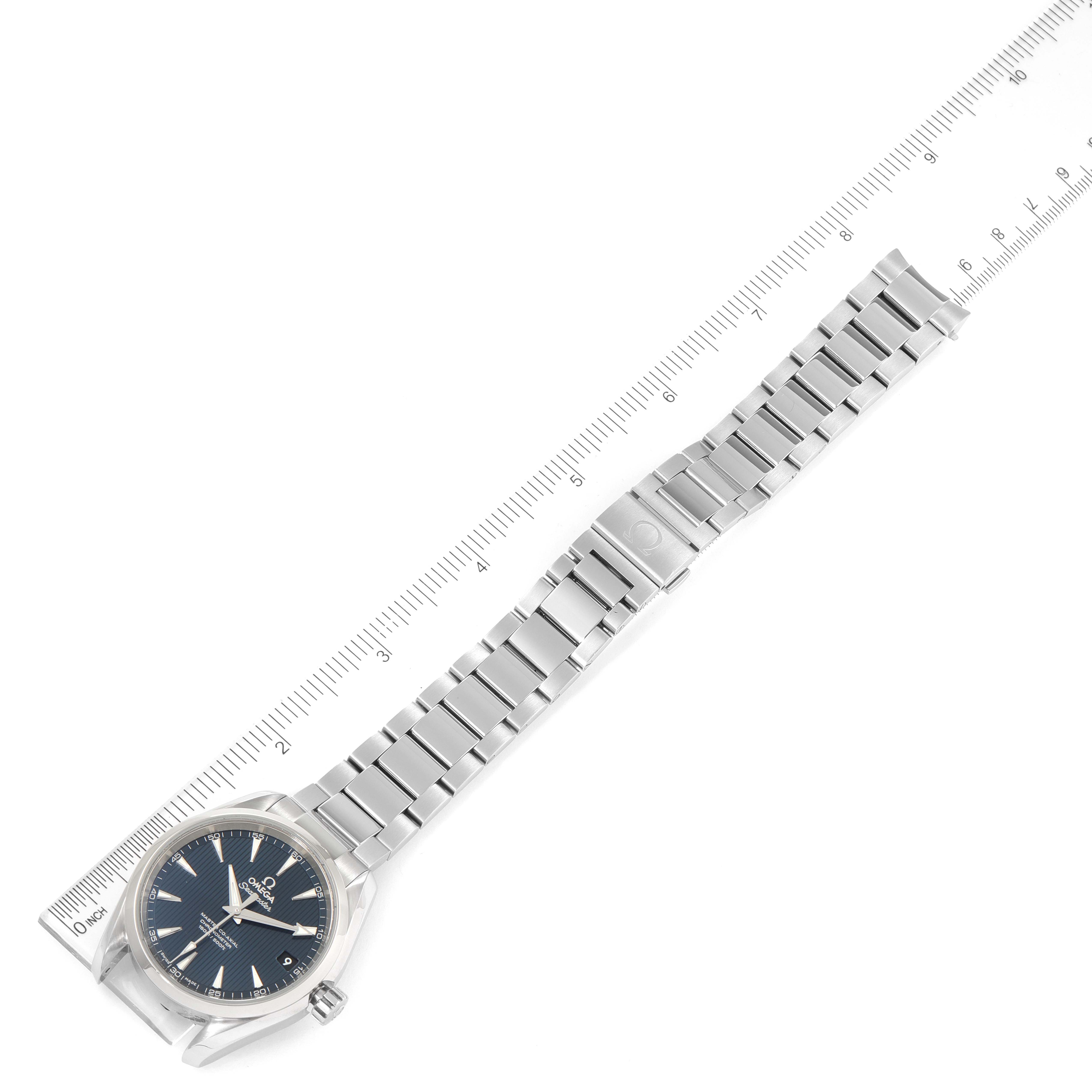 The image shows an Omega Aqua Terra 231.10.39.21.03.002 Men
s Stainless Steel Blue Dial 231.10.39.21.03.002 Men
s Stainless Steel Blue Dial watch laid flat with its metal bracelet aligned with a ruler for scale.