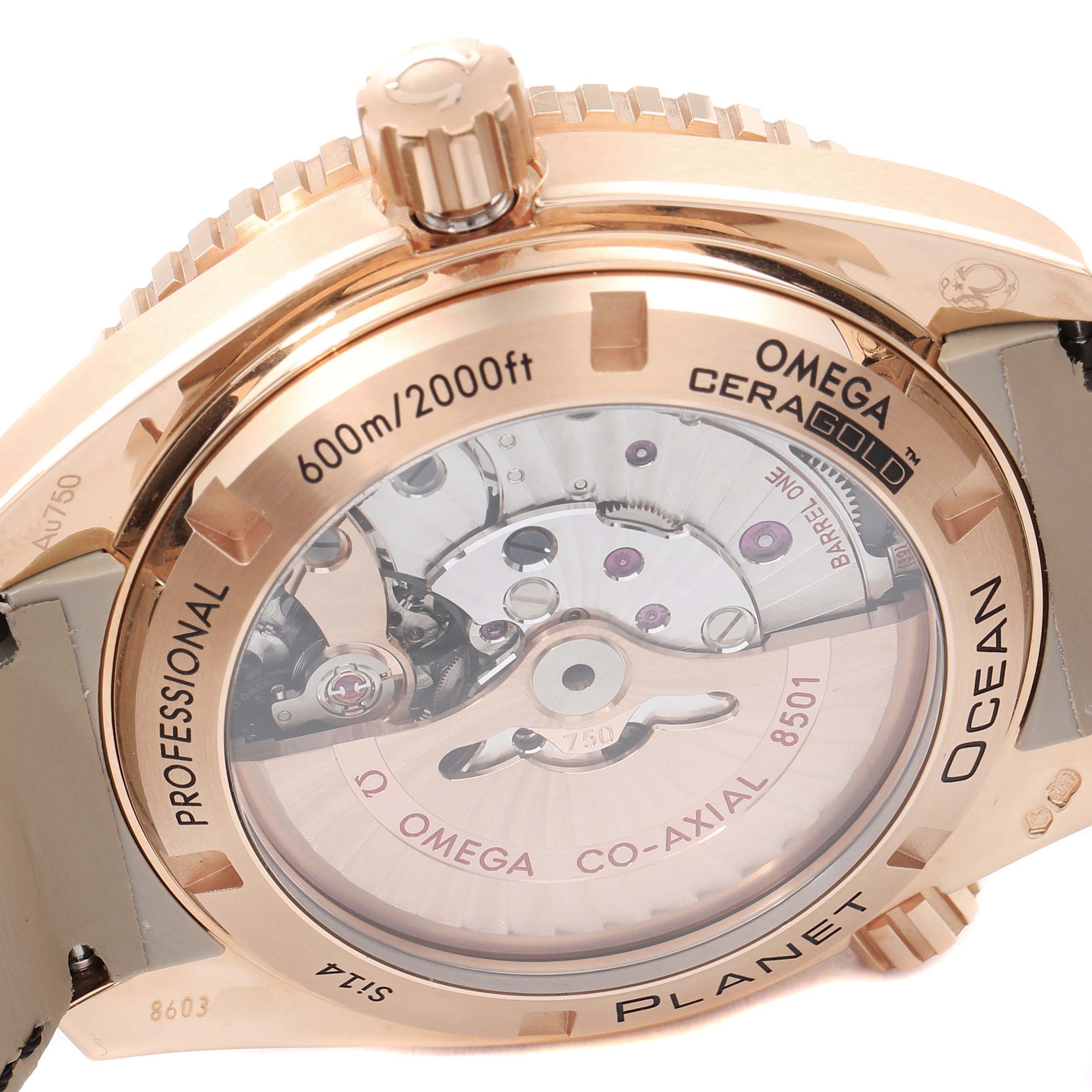 The image shows the rear view of the Omega Planet Ocean 232.63.42.21.01.001 Men's Rose Gold Black Dial 232.63.42.21.01.001 Men's Rose Gold Black Dial watch, showcasing the transparent case back and inner mechanism.