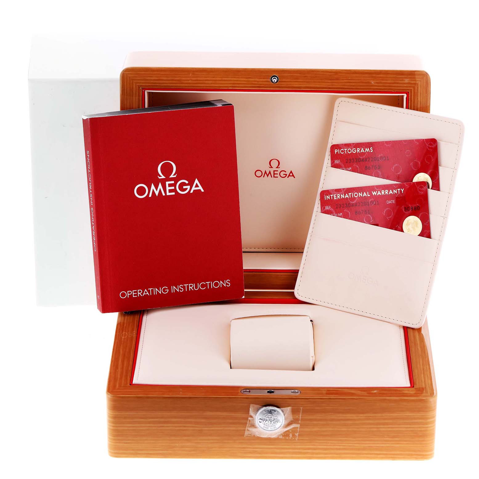 This image shows the packaging, operating instructions, and warranty cards for the Omega Planet Ocean 232.30.44.22.01.001 Men's Stainless Steel Black Dial 232.30.44.22.01.001 Men's Stainless Steel Black Dial watch.