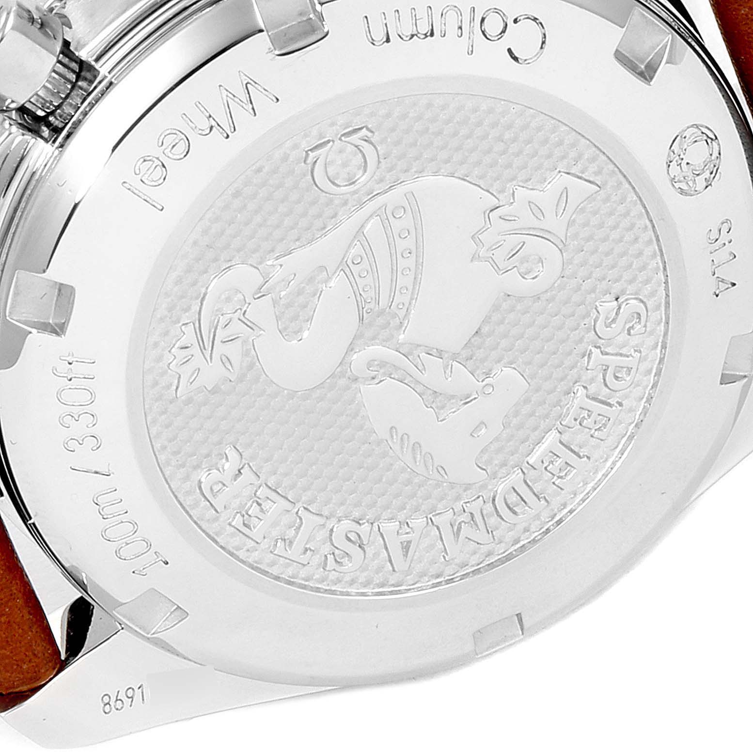 This image shows the backside of an Omega Speedmaster 324.32.38.50.02.001 Men
s Stainless Steel Silver Dial 324.32.38.50.02.001 Men
s Stainless Steel Silver Dial watch, highlighting its engraved case back and surrounding text.