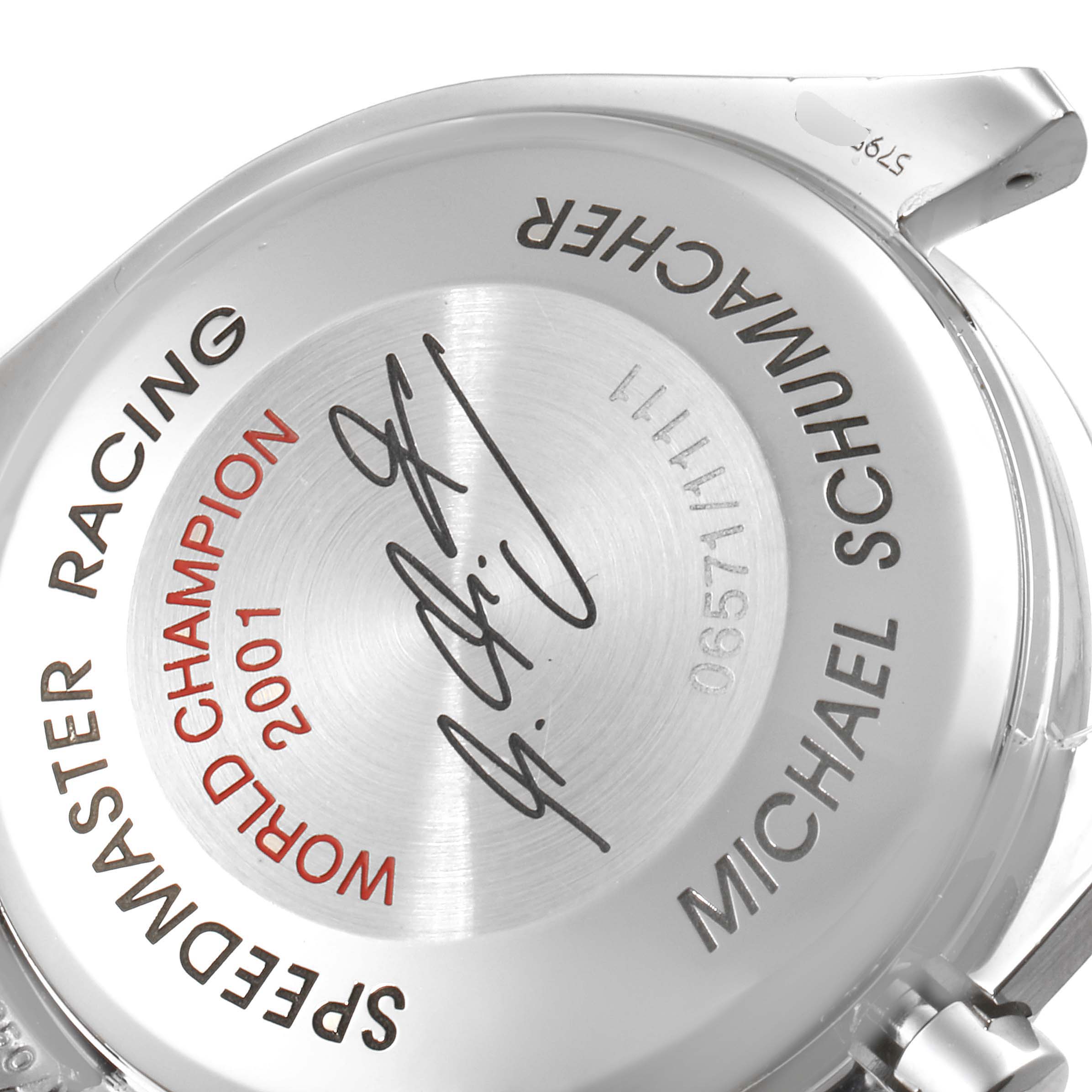 The image shows the case back of an Omega Speedmaster 3519.50.00 Men's Stainless Steel Red Dial 3519.50.00 Men's Stainless Steel Red Dial Racing watch, featuring an inscription and a signature.