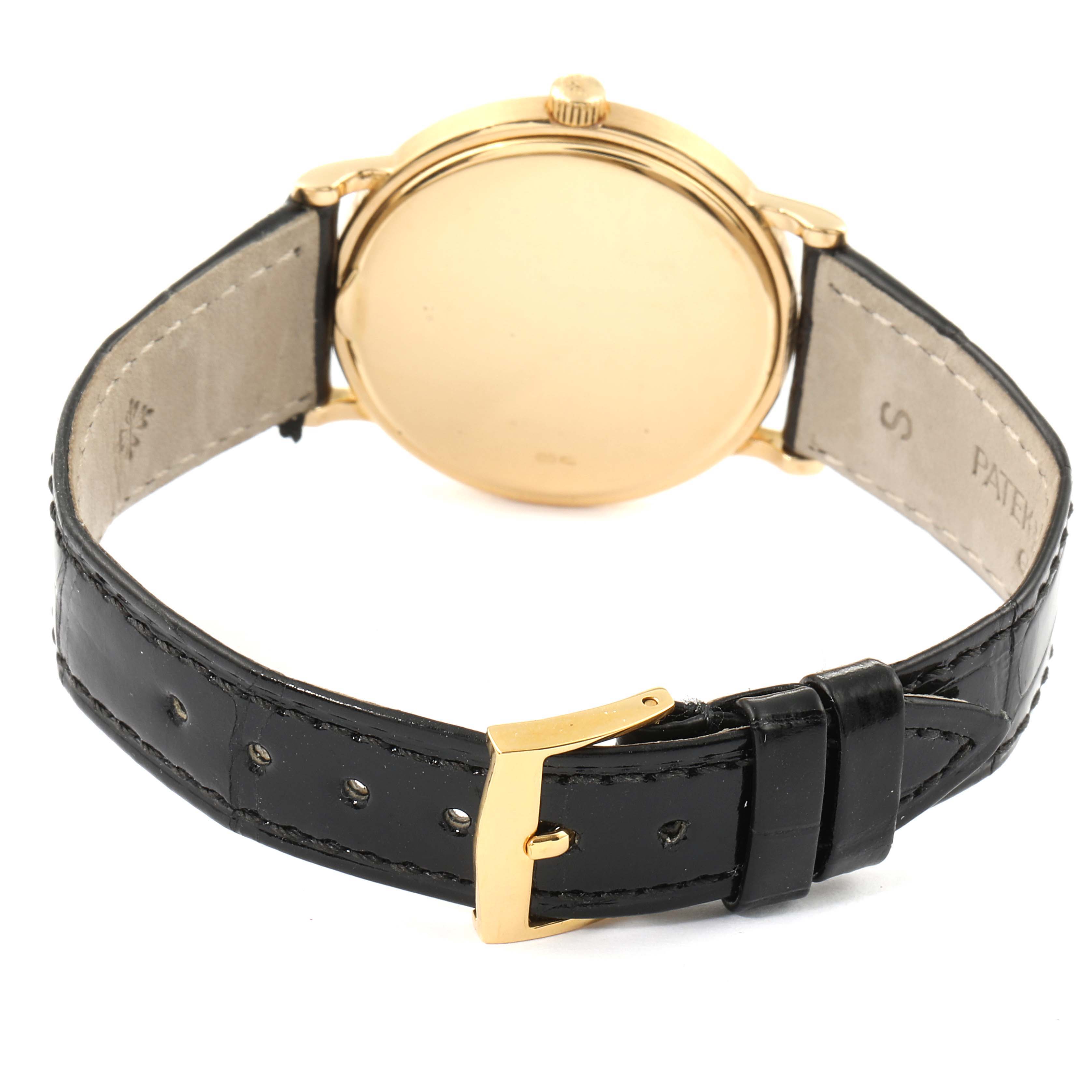 This image shows the back view of a Patek Philippe Calatrava 3992 Men's Yellow Gold White Dial 3992 Men's Yellow Gold White Dial watch, featuring its case back, strap, and clasp.