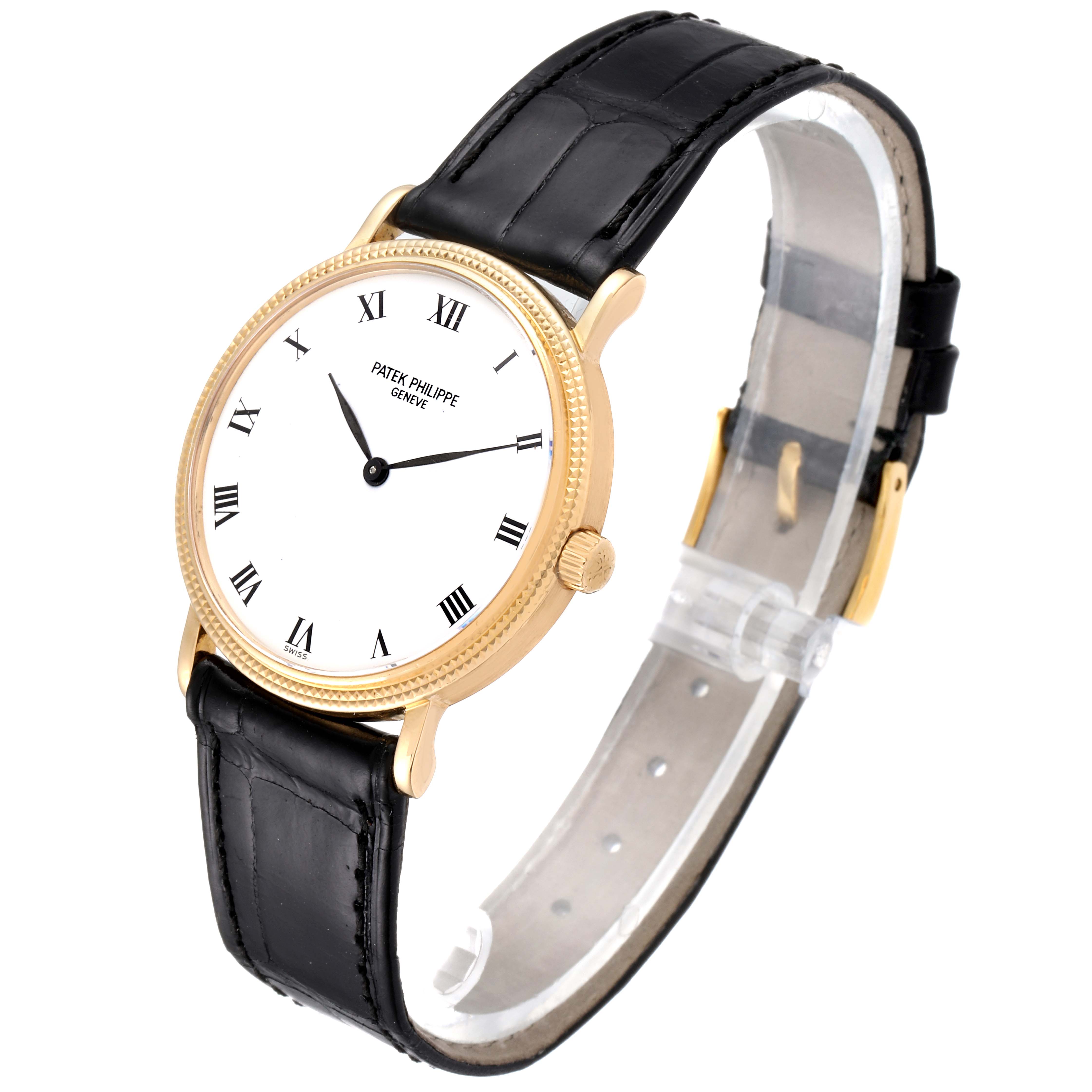 This image shows a side-angle view of a Patek Philippe Calatrava 3992 Men's Yellow Gold White Dial 3992 Men's Yellow Gold White Dial watch with a black leather strap and gold case.