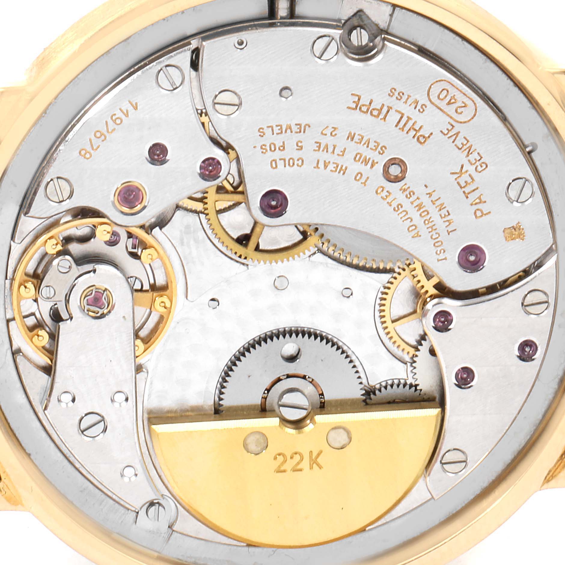 This close-up image shows the intricate inner mechanism of a Patek Philippe Calatrava 3992 Men's Yellow Gold White Dial 3992 Men's Yellow Gold White Dial watch.