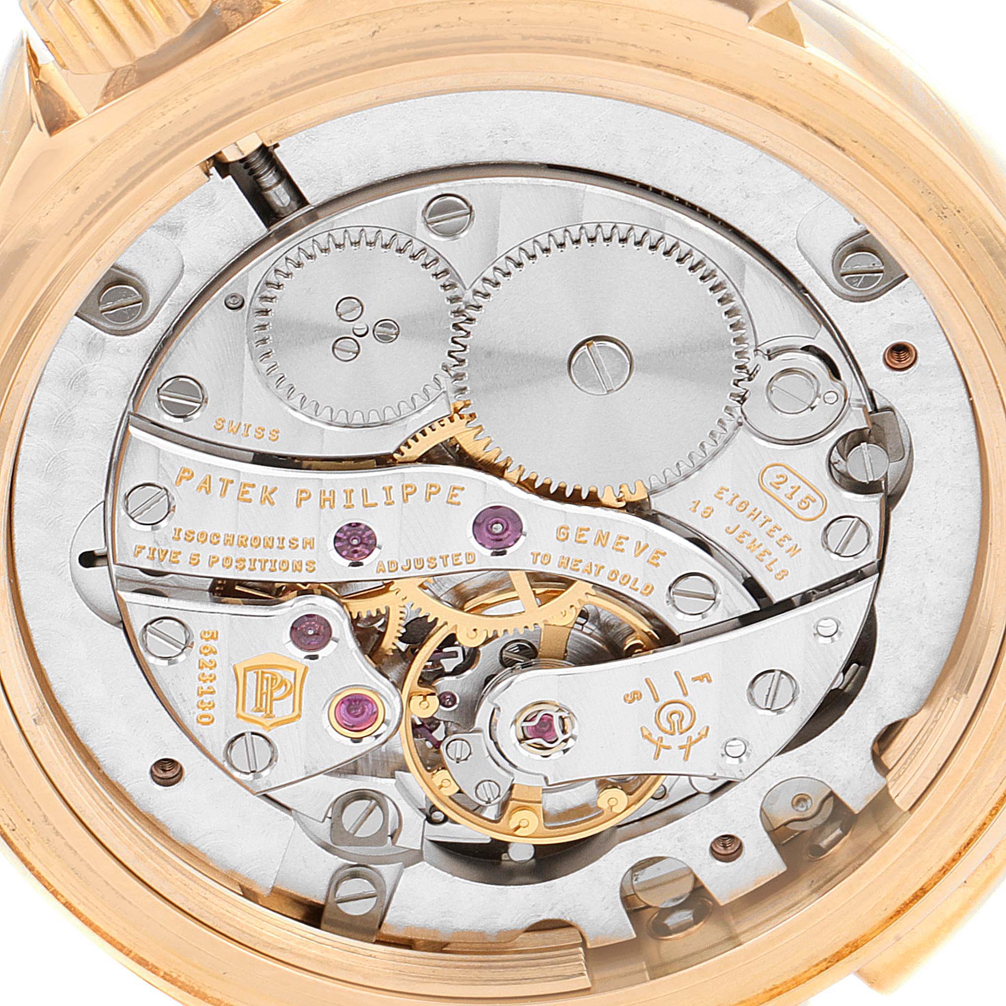 The image shows the intricate inner workings of a Patek Philippe Calatrava 4934R Women's Rose Gold Mother of Pearl Dial 4934R Women's Rose Gold Mother of Pearl Dial model viewed from the back, revealing gears and mechanical parts.