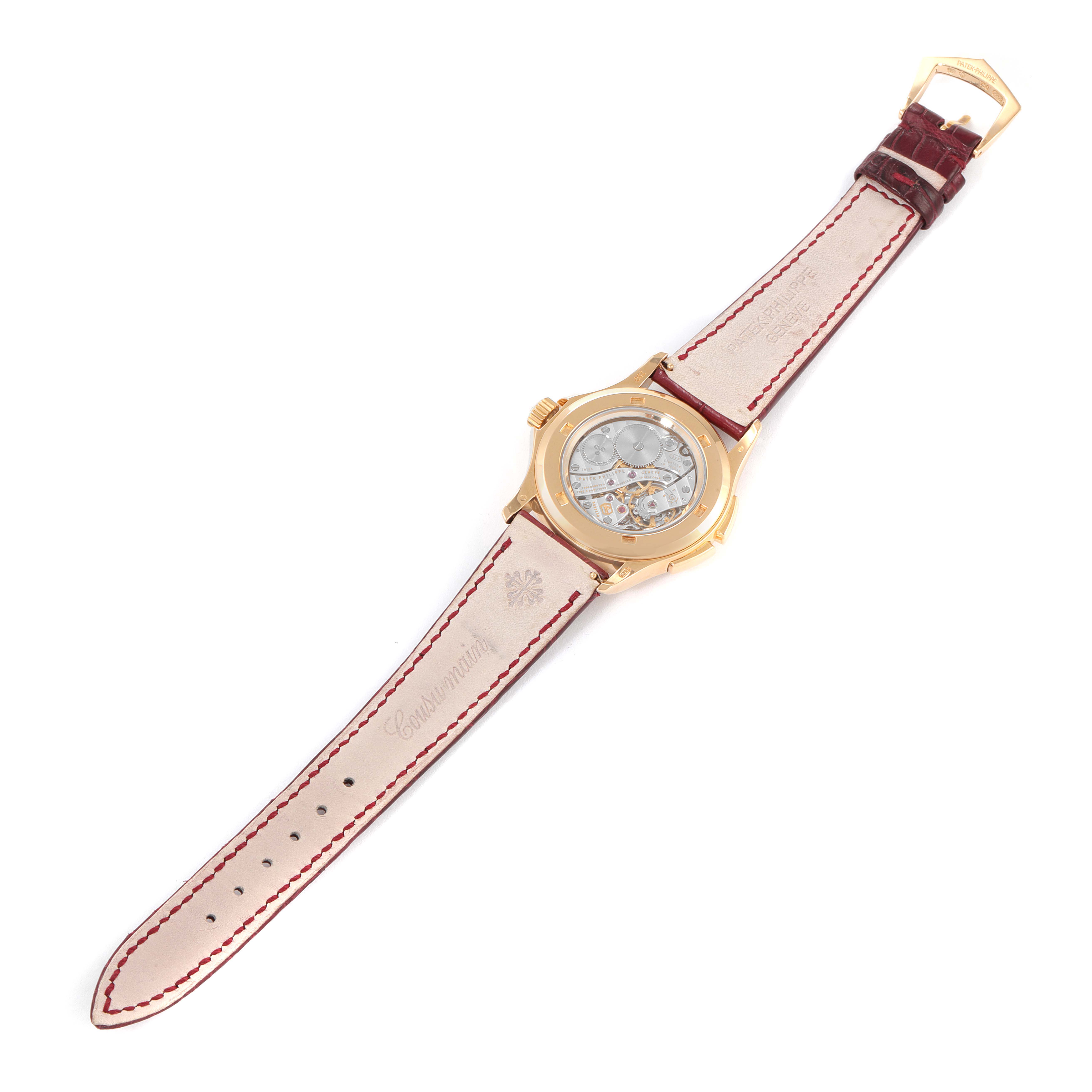 The image shows the back view of the Calatrava model by Patek Philippe, highlighting the leather strap and open back case.