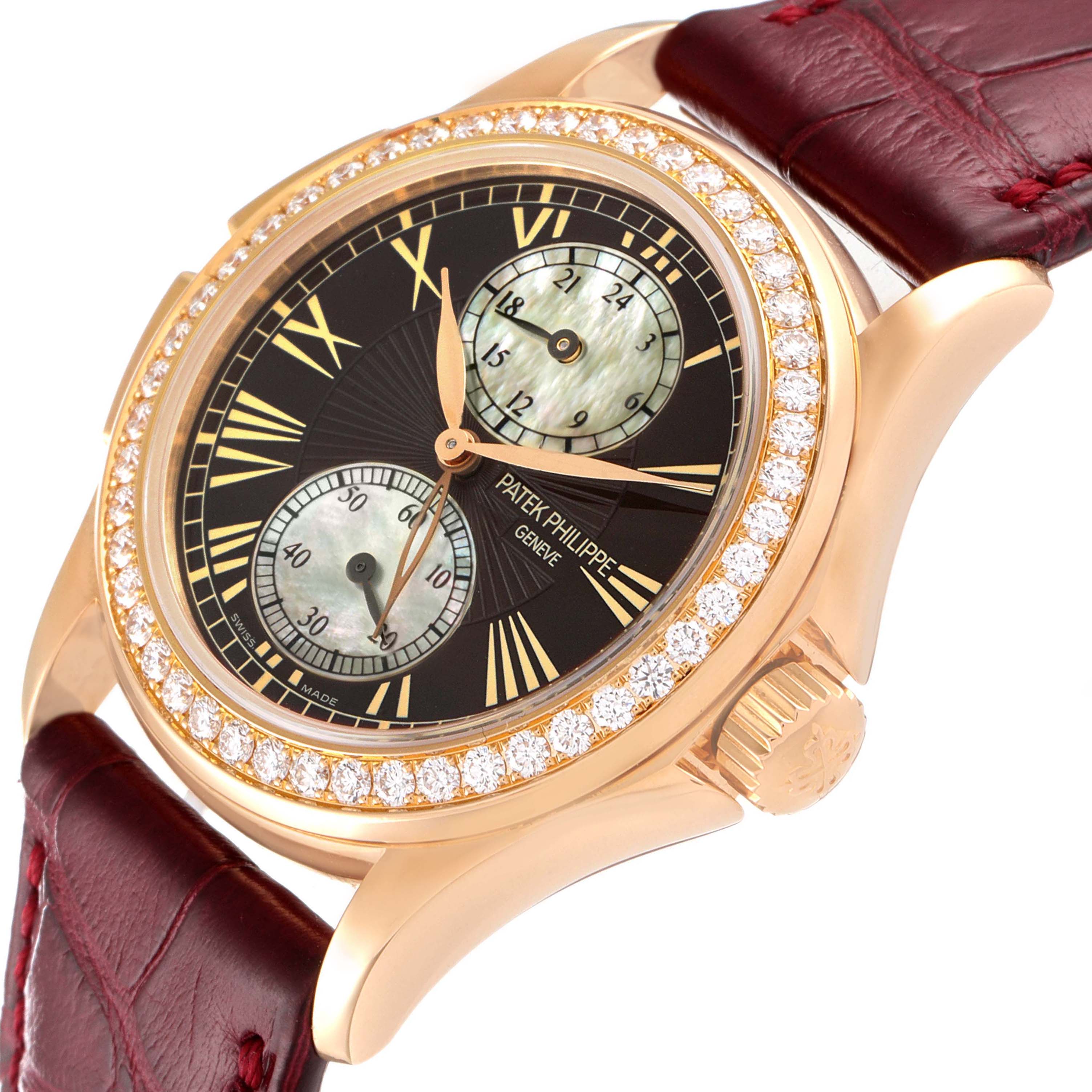 The image shows a close-up angle of a Patek Philippe Calatrava 4934R Women's Rose Gold Mother of Pearl Dial 4934R Women's Rose Gold Mother of Pearl Dial watch featuring a diamond bezel, sub-dials, and a leather strap.
