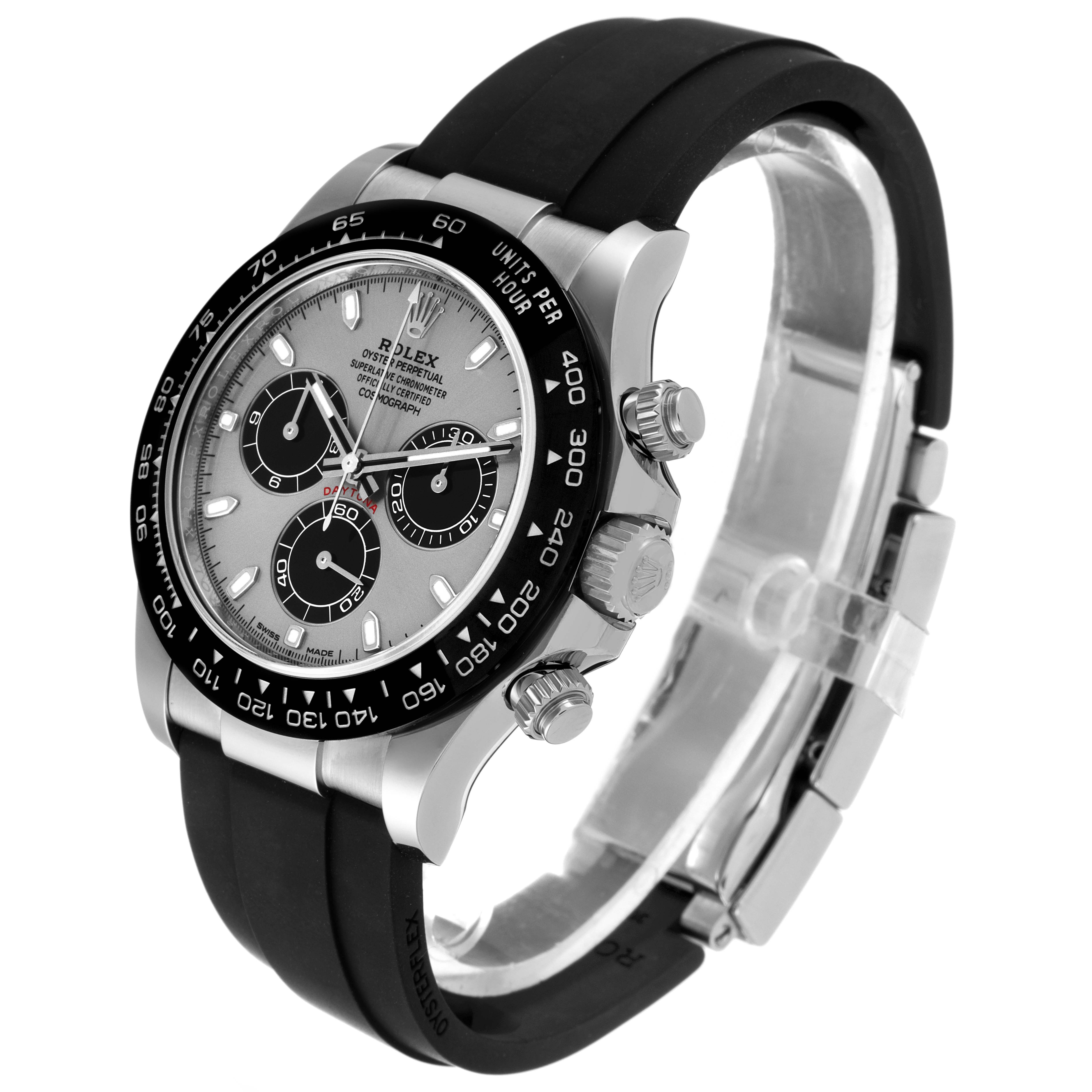 The Rolex Daytona 116519 Men's White Gold Grey Dial 116519 Men's White Gold Grey Dial watch is shown at a three-quarter angle, displaying the face, bezel, and rubber strap in detail.