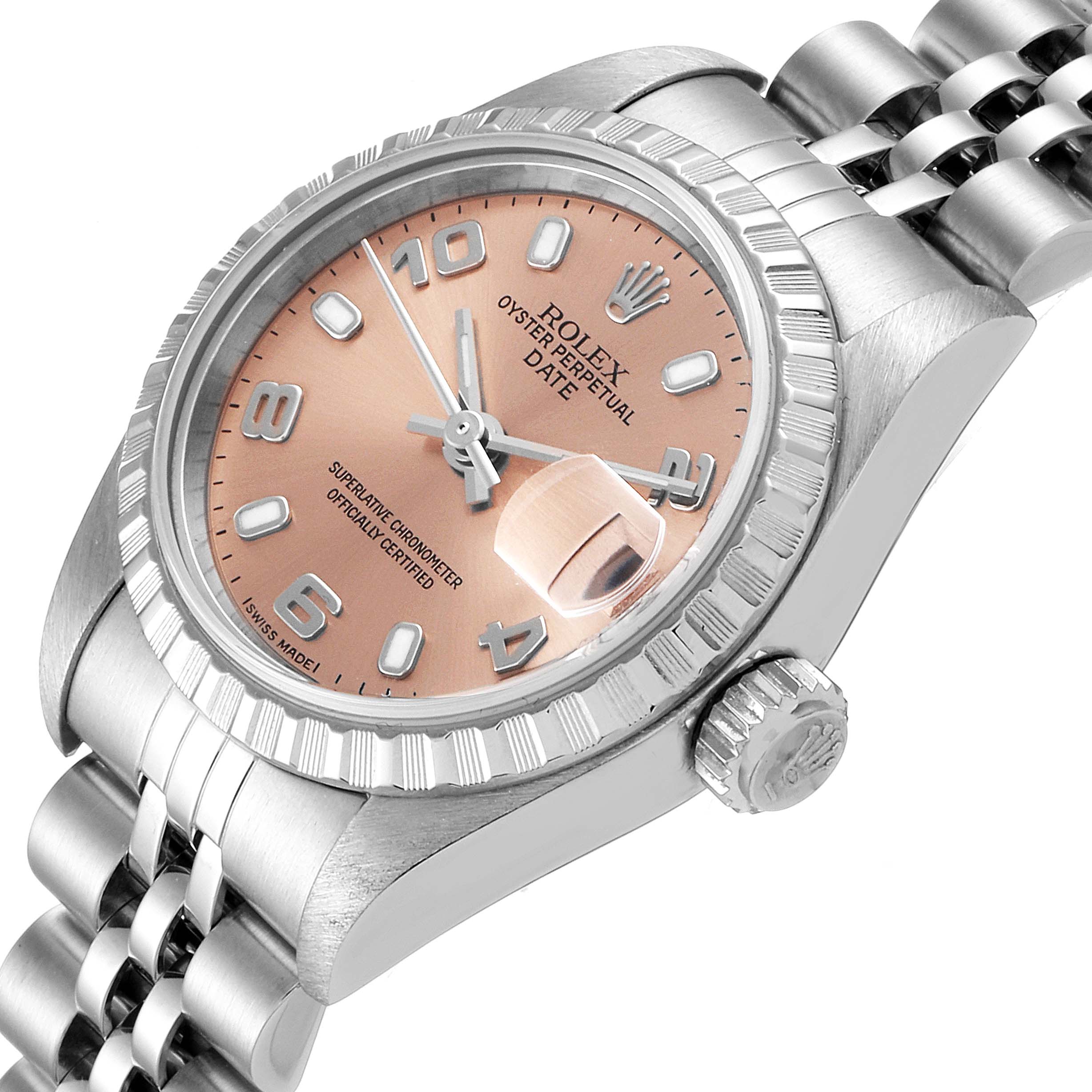 The image shows a close-up angled view of a Rolex Date 79240 Women's Stainless Steel Pink Dial 79240 Women's Stainless Steel Pink Dial model watch, highlighting the dial, bezel, crown, and part of the bracelet.