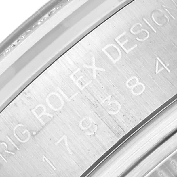 This close-up image shows the inner bezel and engraved details of a Rolex Datejust 179384 Women's Stainless Steel White Dial 179384 Women's Stainless Steel White Dial watch.