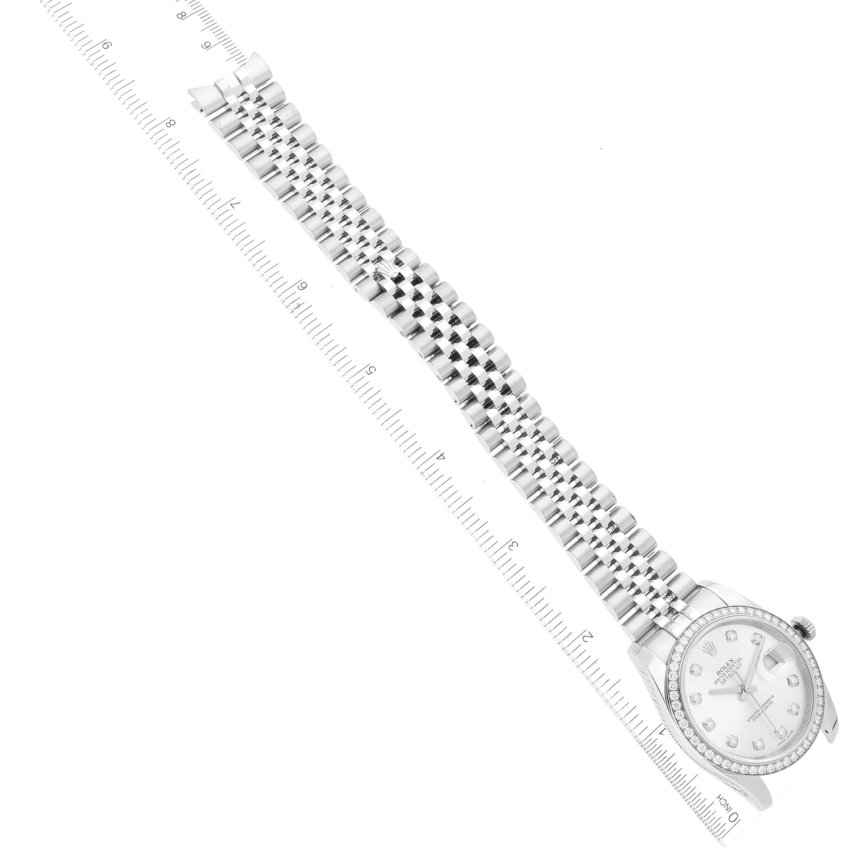 This image shows a top view of a Rolex Datejust 116244 Men's Stainless Steel Silver Dial 116244 Men's Stainless Steel Silver Dial watch, displaying its face, bezel, and bracelet, aligned next to a ruler for scale.