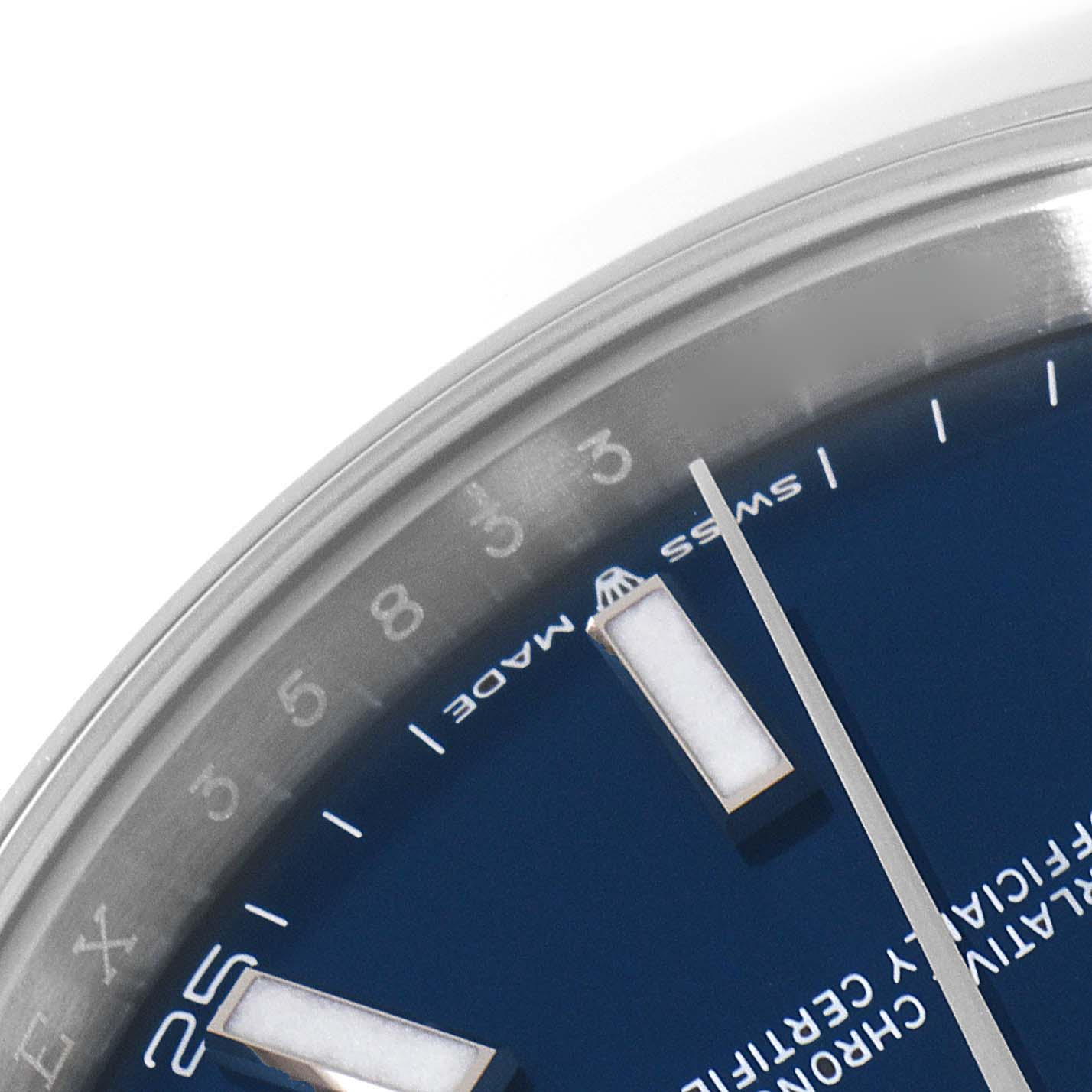 This close-up image of the Rolex Datejust 41 126300 Men
s Stainless Steel Blue Dial 126300 Men
s Stainless Steel Blue Dial watch shows part of the blue dial, indices, and partial numbers on the outer rim.