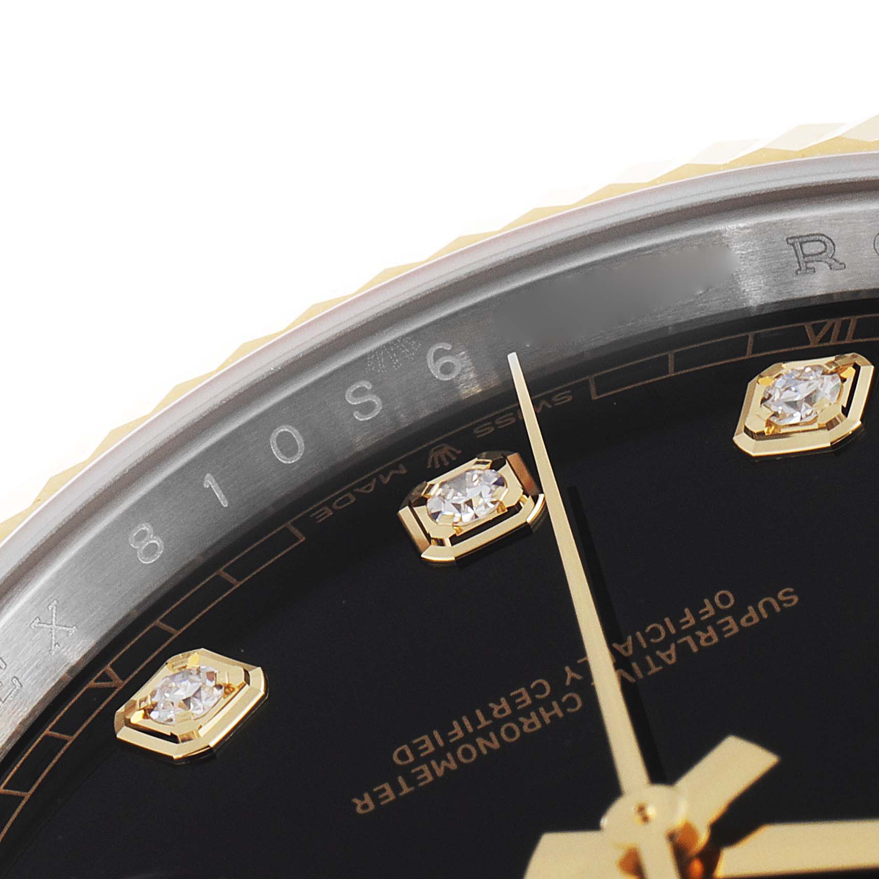 This image shows a close-up of the Rolex Datejust 41 126333 Men's Steel and Gold (two tone) Black Dial 126333 Men's Steel and Gold (two tone) Black Dial dial, featuring diamond markers and parts of the hour and minute hands.