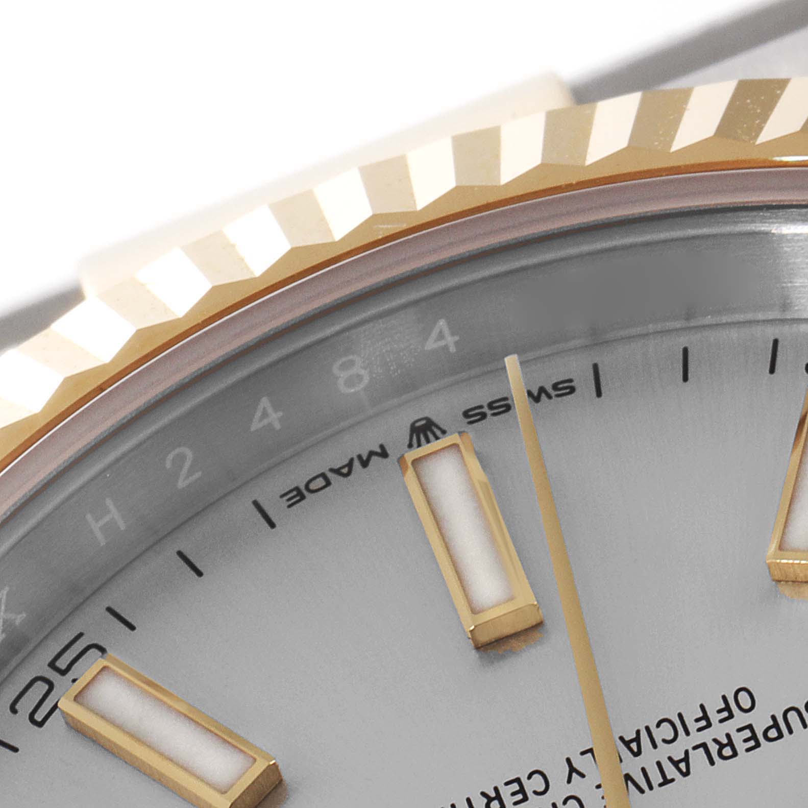 This close-up image shows the dial, markers, hands, and part of the fluted bezel of the Rolex Datejust 41 126333 Men
s Steel and Gold (two tone) Silver Dial 126333 Men
s Steel and Gold (two tone) Silver Dial watch.