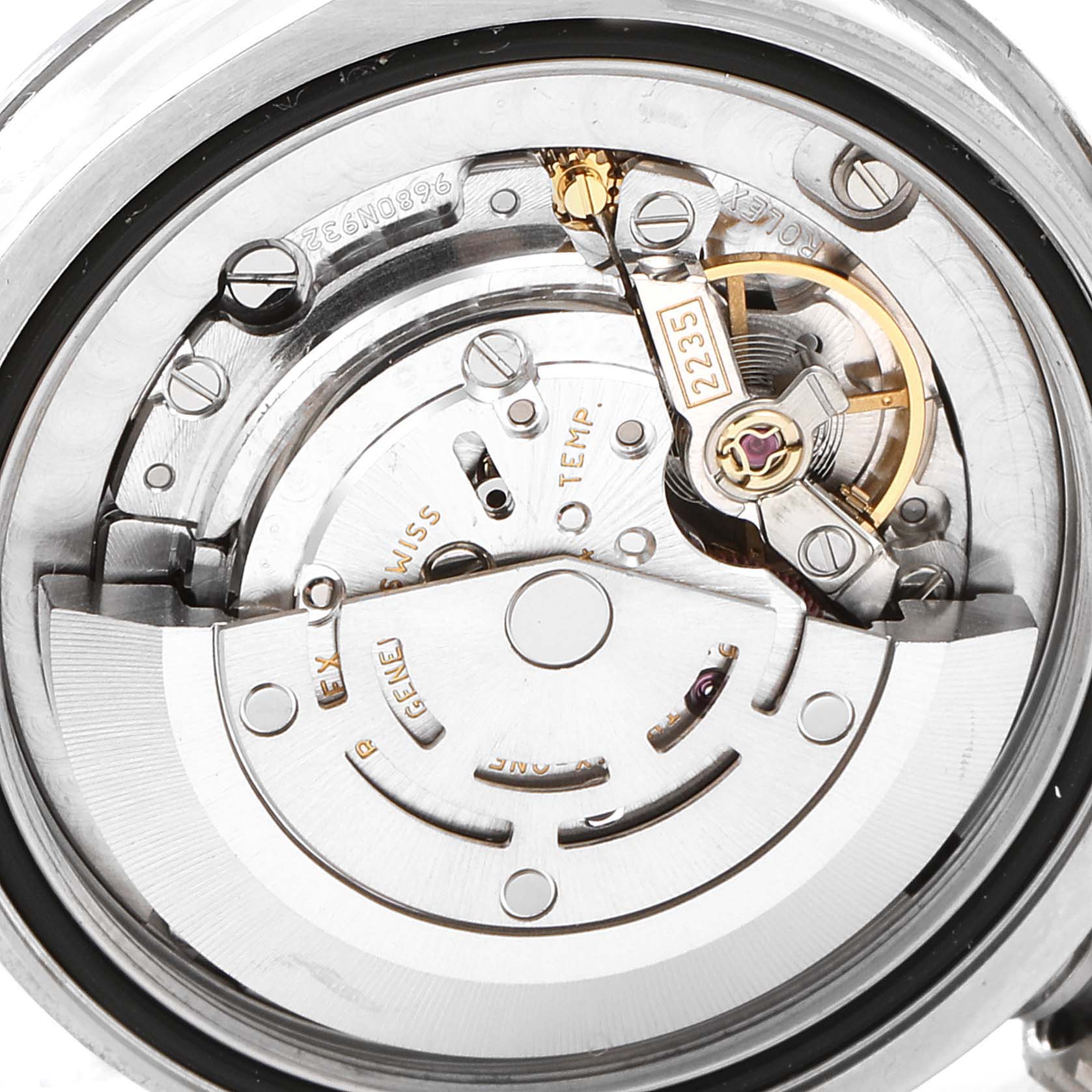 This image shows the internal movement mechanism of a Mid-Size Rolex watch from a close-up angle.