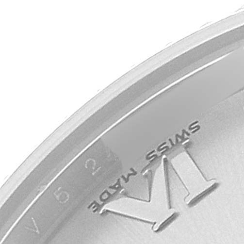 The image shows a close-up view of the dial and part of the bezel of a Mid-Size Rolex watch, focusing on the Roman numeral VI and "Swiss Made" text.