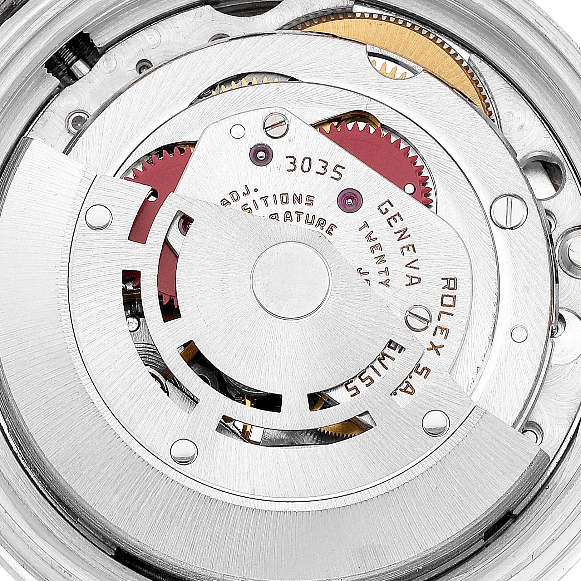 This is a close-up view of the movement mechanism of a Rolex Vintage Collection 16030 Men's Stainless Steel Silver Dial 16030 Men's Stainless Steel Silver Dial model, showing gears and inscriptions.