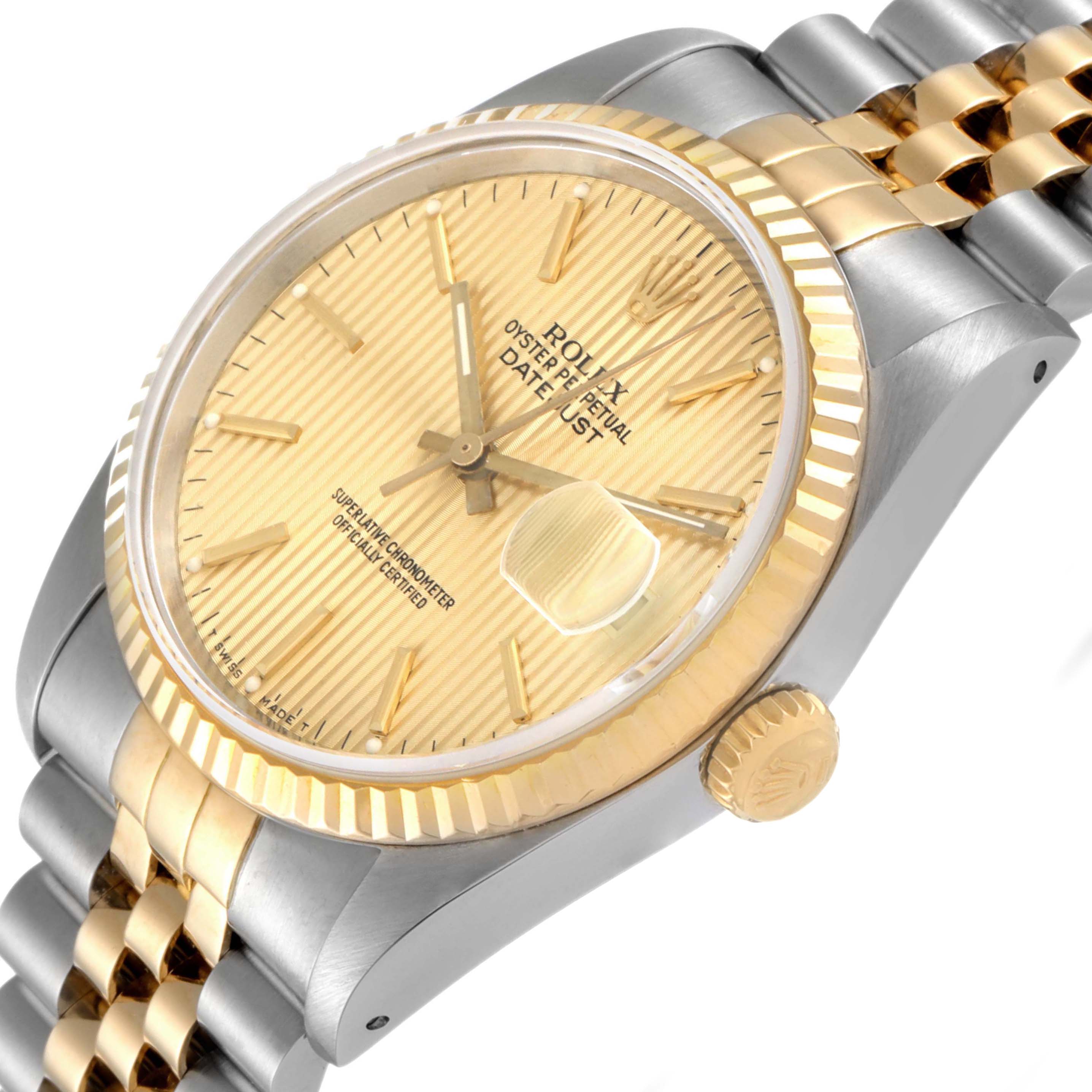 The image shows a close-up angle of the face, bezel, crown, and part of the bracelet of a Rolex Datejust 16233 Men
s Steel and Gold (two tone) Champagne Dial 16233 Men
s Steel and Gold (two tone) Champagne Dial watch.