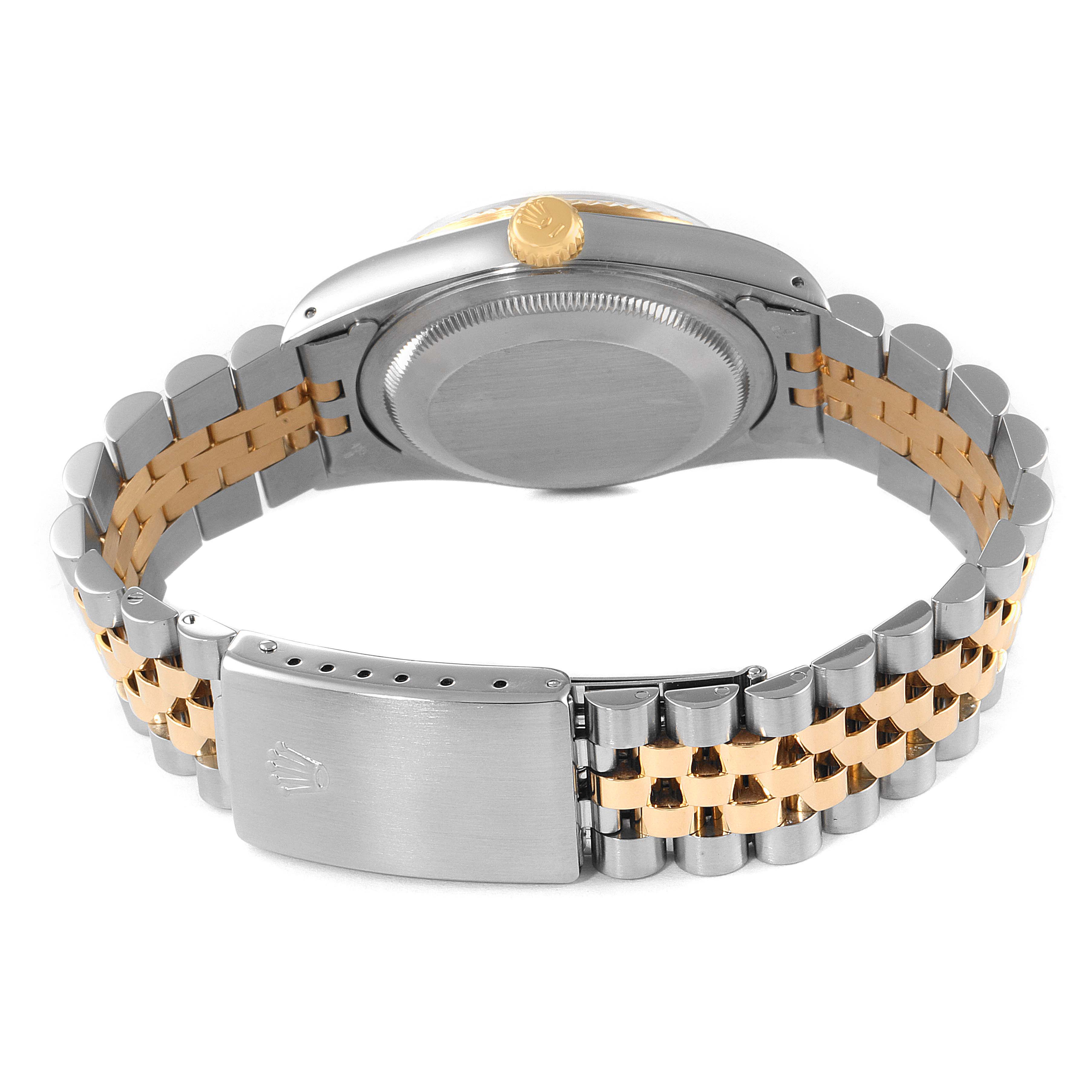 This image shows the back case and bracelet of the Rolex Datejust 16233 Men
s Steel and Gold (two tone) Champagne Dial 16233 Men
s Steel and Gold (two tone) Champagne Dial watch, highlighting its two-tone metal design.