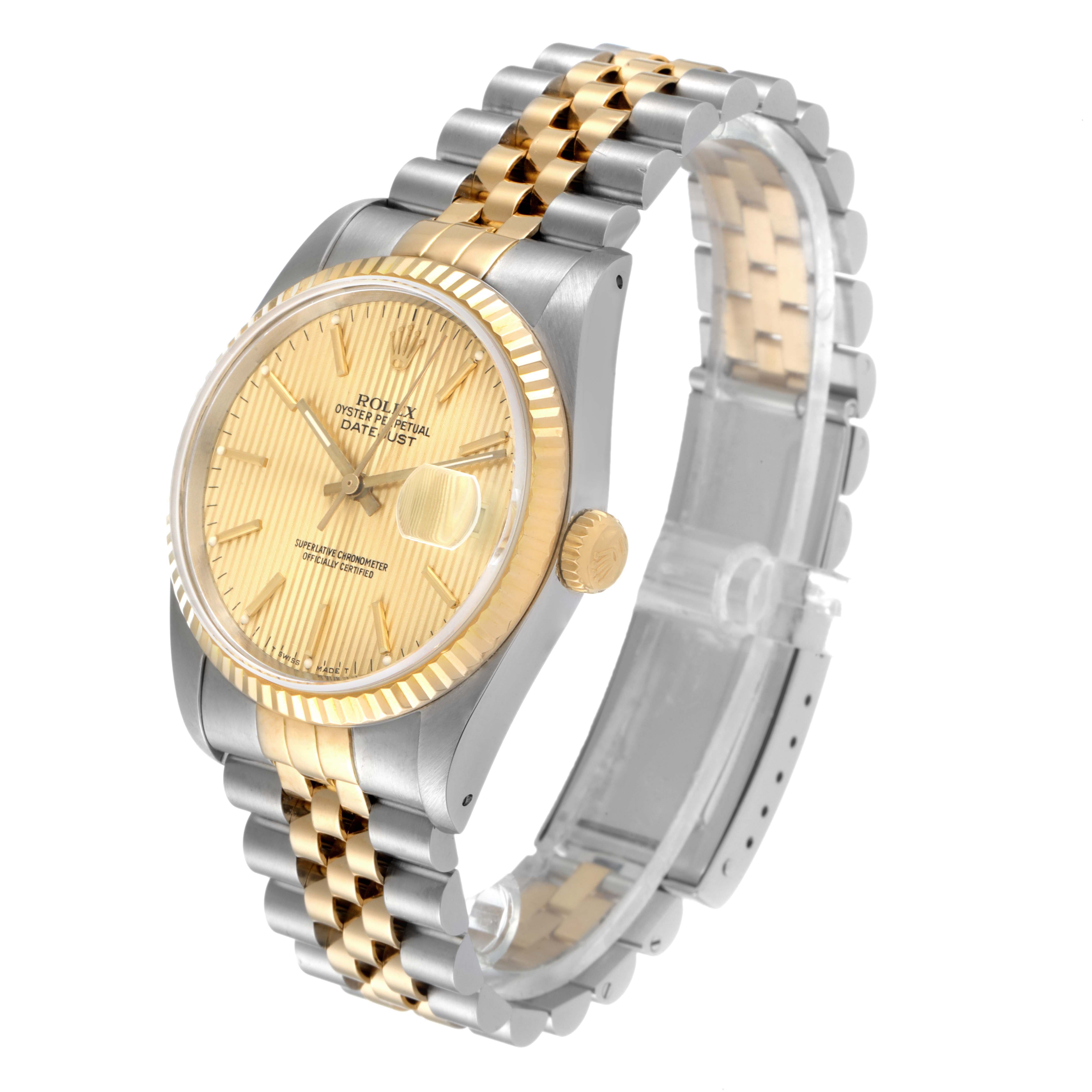 The image shows a Rolex Datejust 16233 Men
s Steel and Gold (two tone) Champagne Dial 16233 Men
s Steel and Gold (two tone) Champagne Dial watch at an angle, highlighting its gold dial, two-tone bracelet, and fluted bezel.