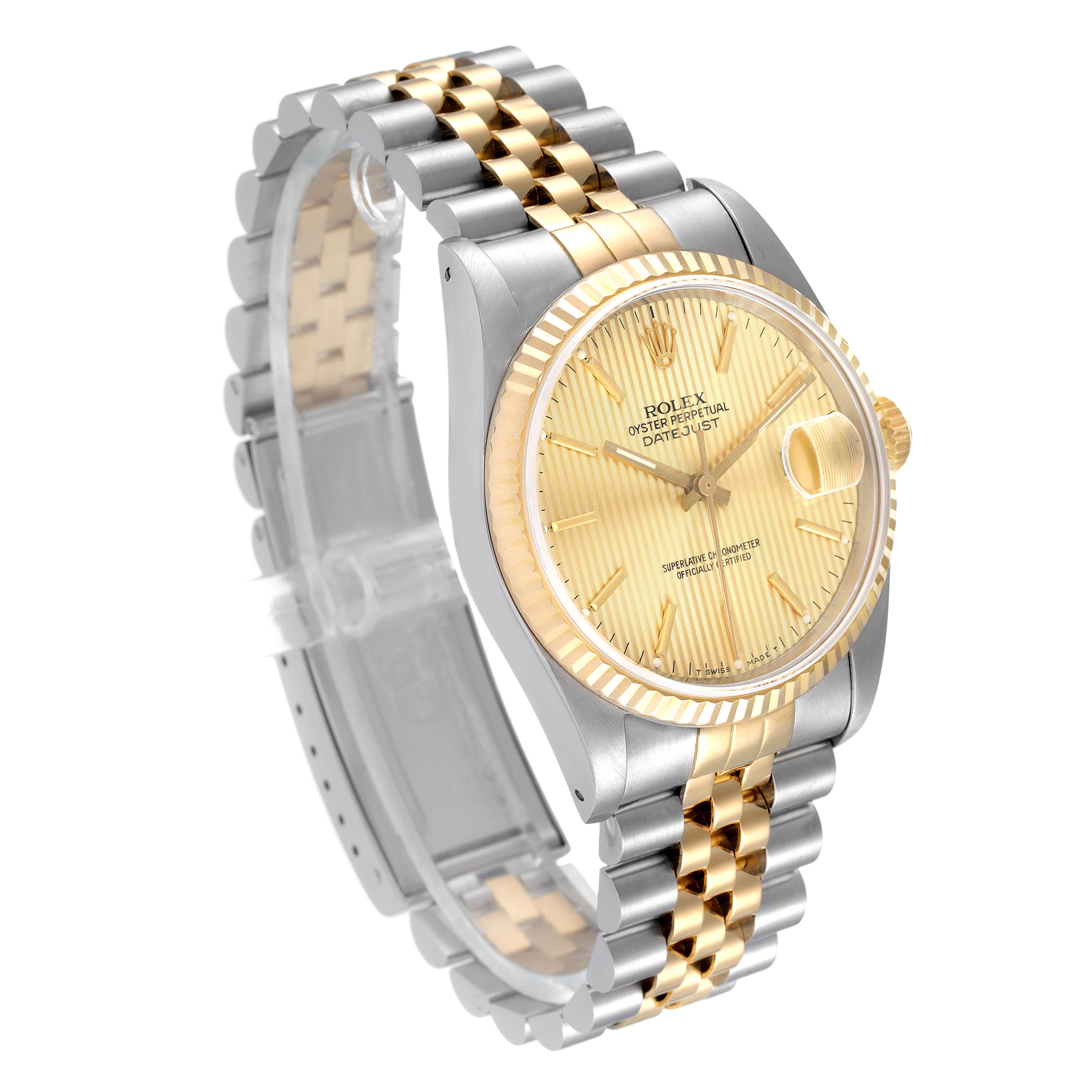 The image shows a Rolex Datejust 16233 Men
s Steel and Gold (two tone) Champagne Dial 16233 Men
s Steel and Gold (two tone) Champagne Dial watch from a semi-side angle, highlighting its two-tone bracelet, dial, and bezel.