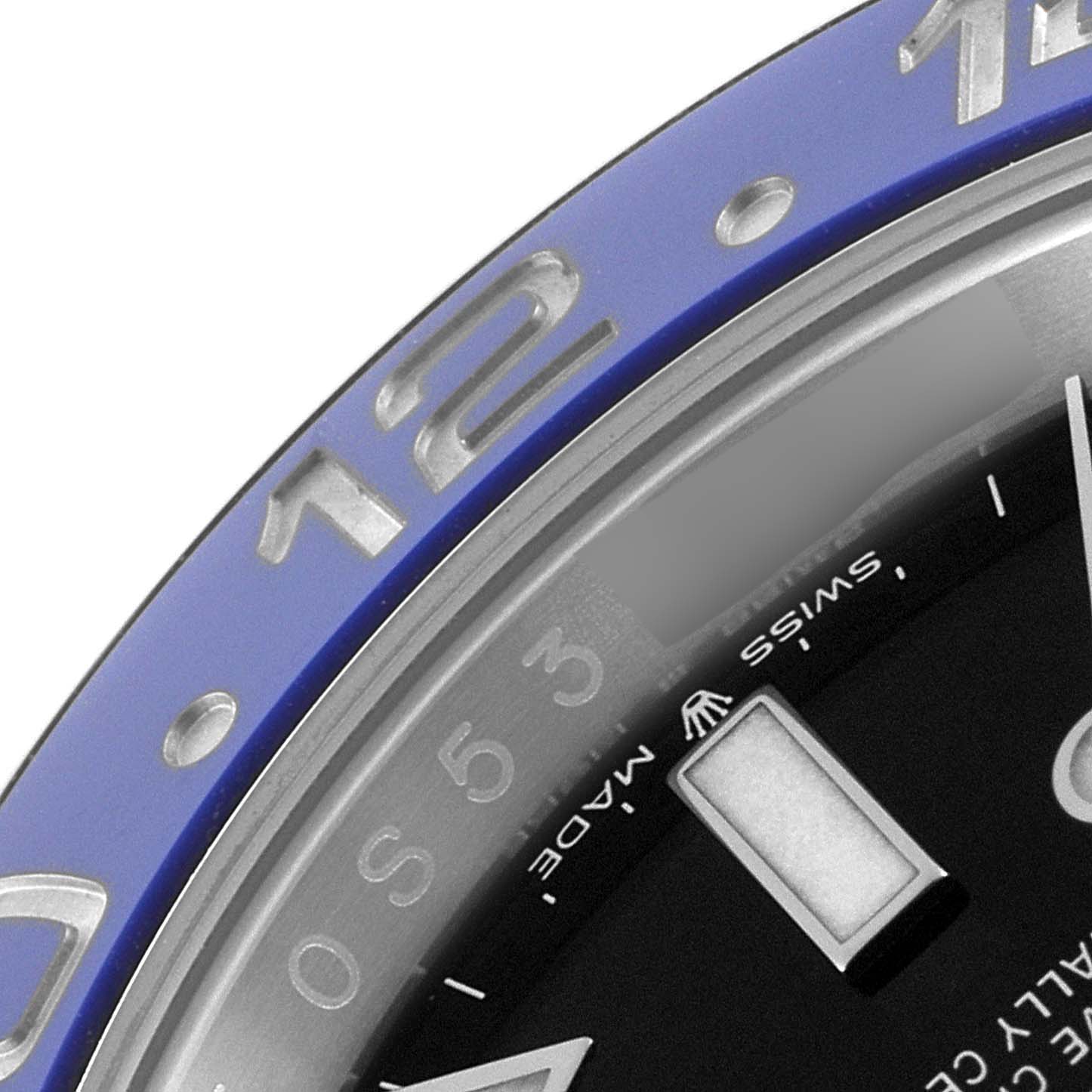 The image shows a close-up of the bezel and part of the dial of a Rolex GMT-Master 126710BLNR Men
s Stainless Steel Black Dial 126710BLNR Men
s Stainless Steel Black Dial watch.