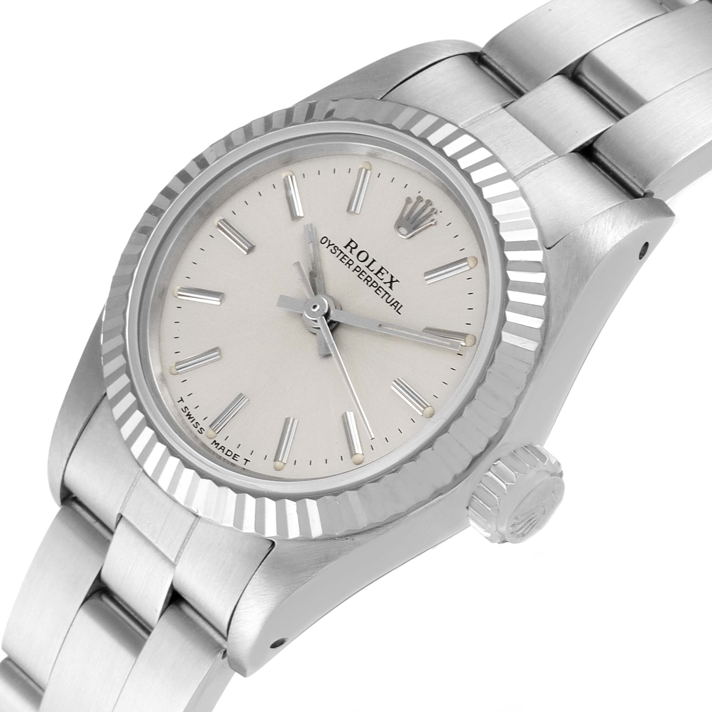 The image shows the Rolex Oyster Perpetual 67194 Women's Stainless Steel Silver Dial 67194 Women's Stainless Steel Silver Dial watch from a high-angle view, displaying the face, bezel, crown, and part of the bracelet.