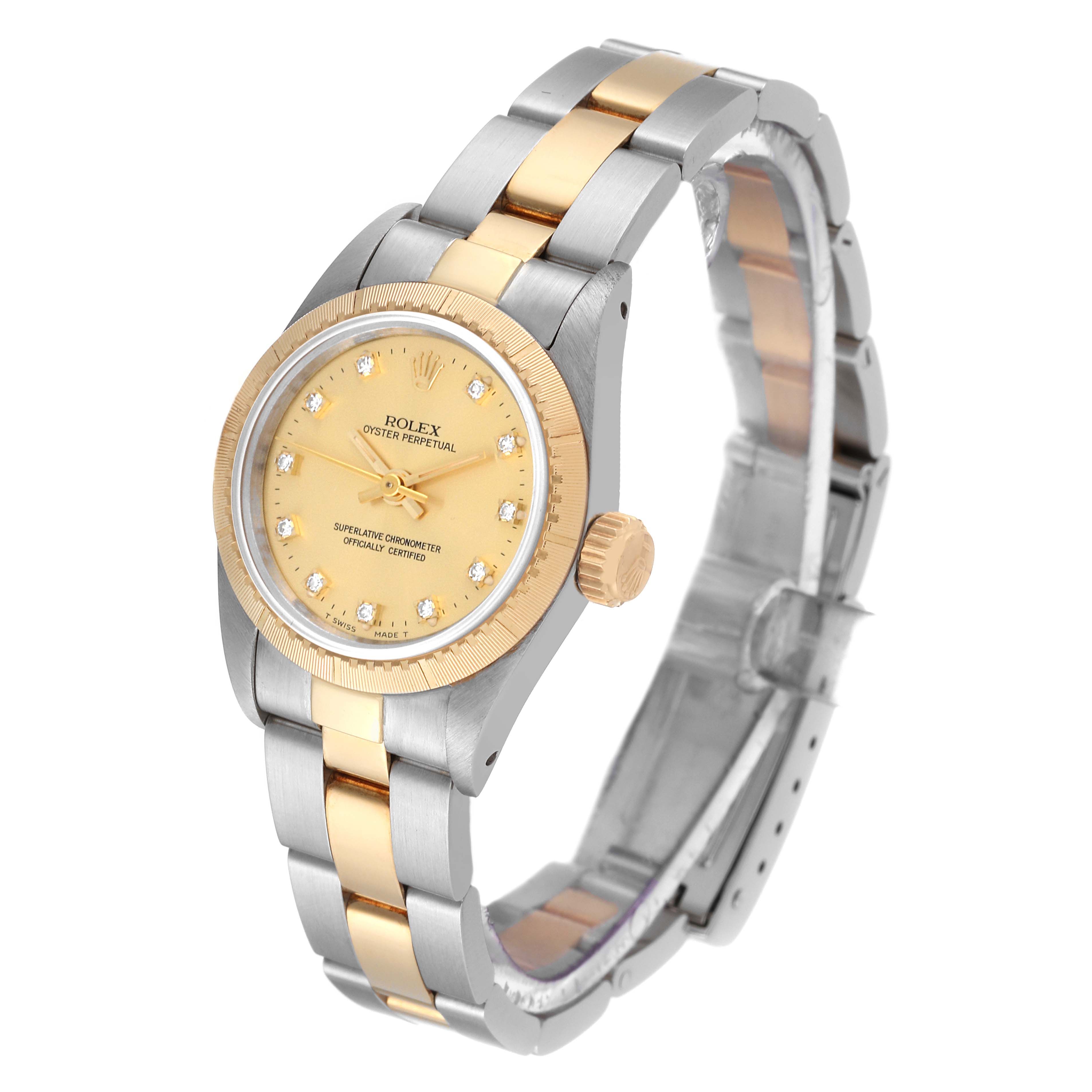 The Rolex Oyster Perpetual 67243 Women's Steel and Gold (two tone) Champagne Dial 67243 Women's Steel and Gold (two tone) Champagne Dial watch is shown at a slight angle displaying its face, bezel, crown, and bracelet.