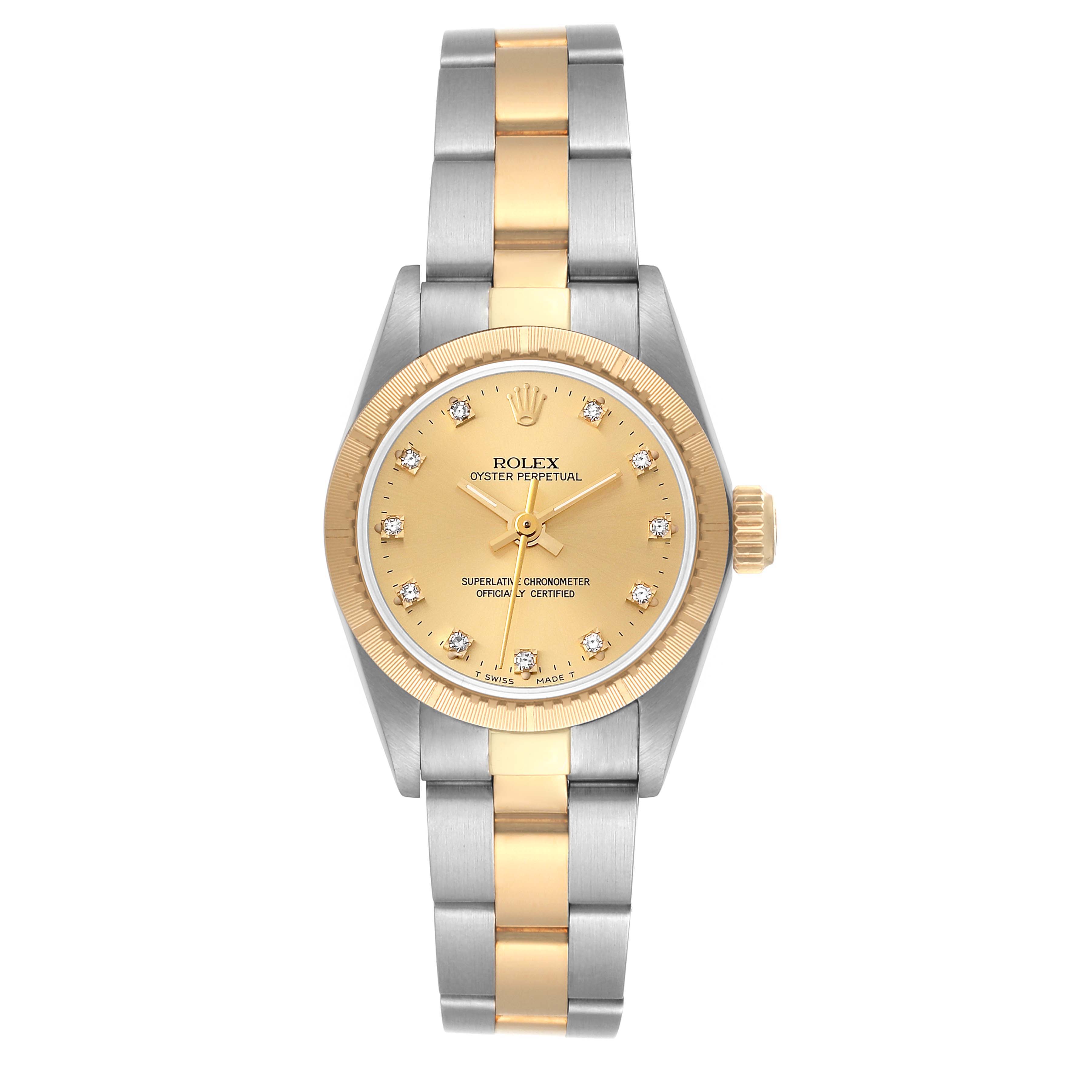 This is a front view of a Rolex Oyster Perpetual 67243 Women's Steel and Gold (two tone) Champagne Dial 67243 Women's Steel and Gold (two tone) Champagne Dial watch showing its gold and silver bracelet, gold bezel, and gold dial with diamond markers.