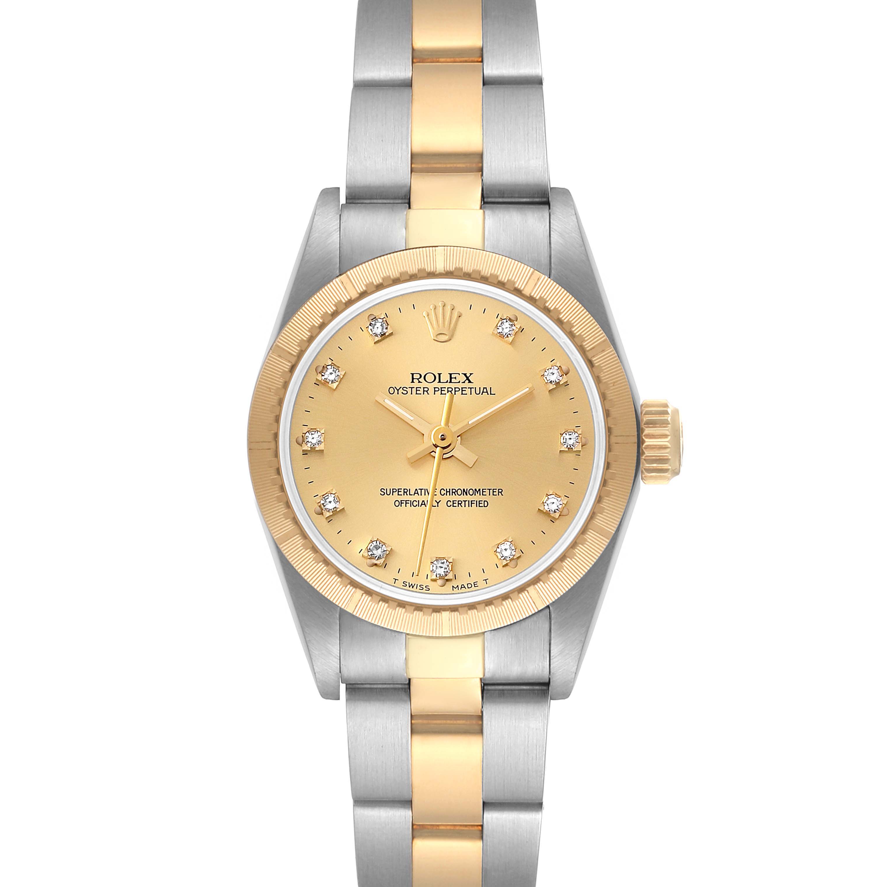 The image shows a frontal view of the Rolex Oyster Perpetual 67243 Women's Steel and Gold (two tone) Champagne Dial 67243 Women's Steel and Gold (two tone) Champagne Dial watch, highlighting its gold dial, diamond hour markers, and two-tone bracelet.