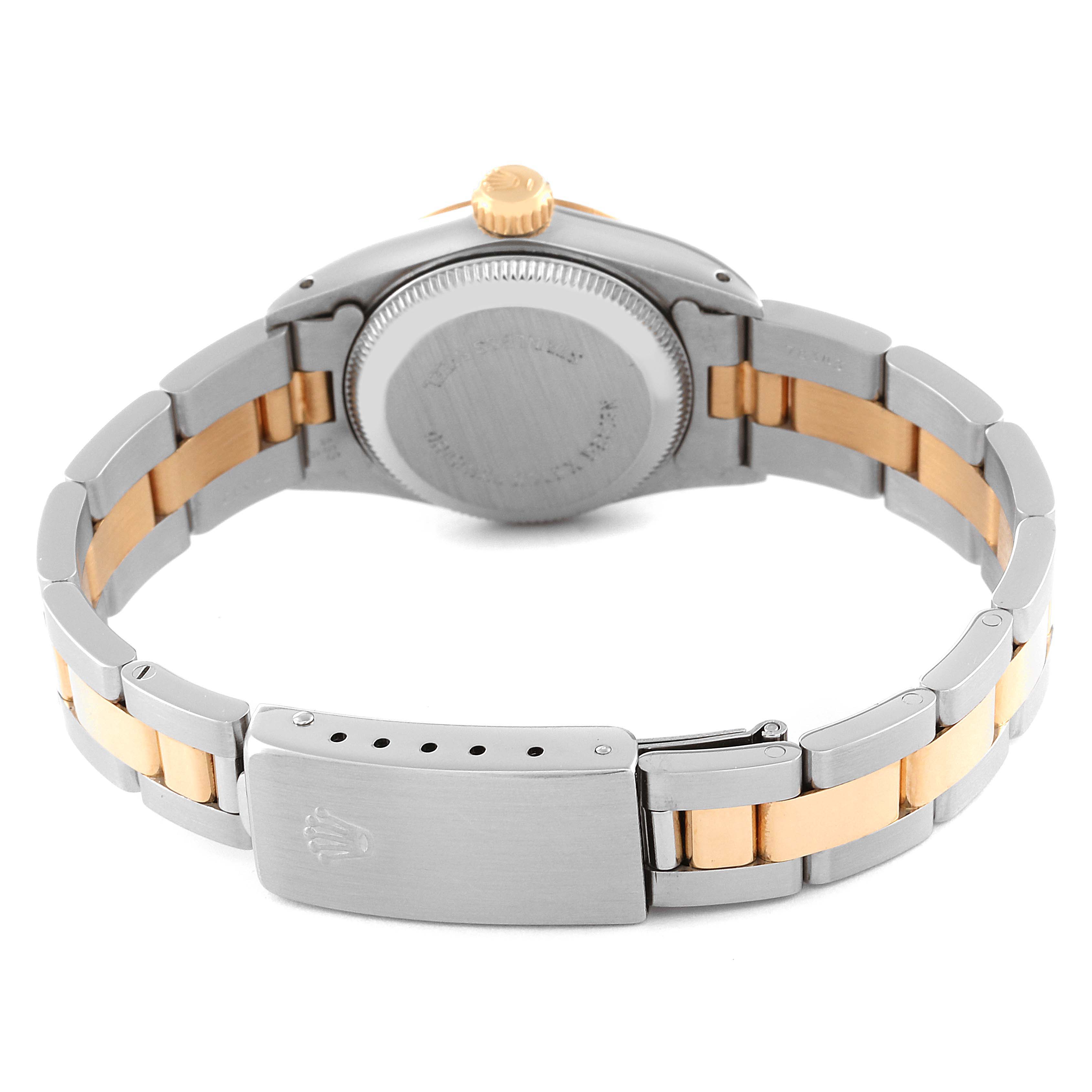 This image shows the back side of a Rolex Oyster Perpetual 67243 Women's Steel and Gold (two tone) Champagne Dial 67243 Women's Steel and Gold (two tone) Champagne Dial watch, highlighting the bracelet, clasp, and case back.