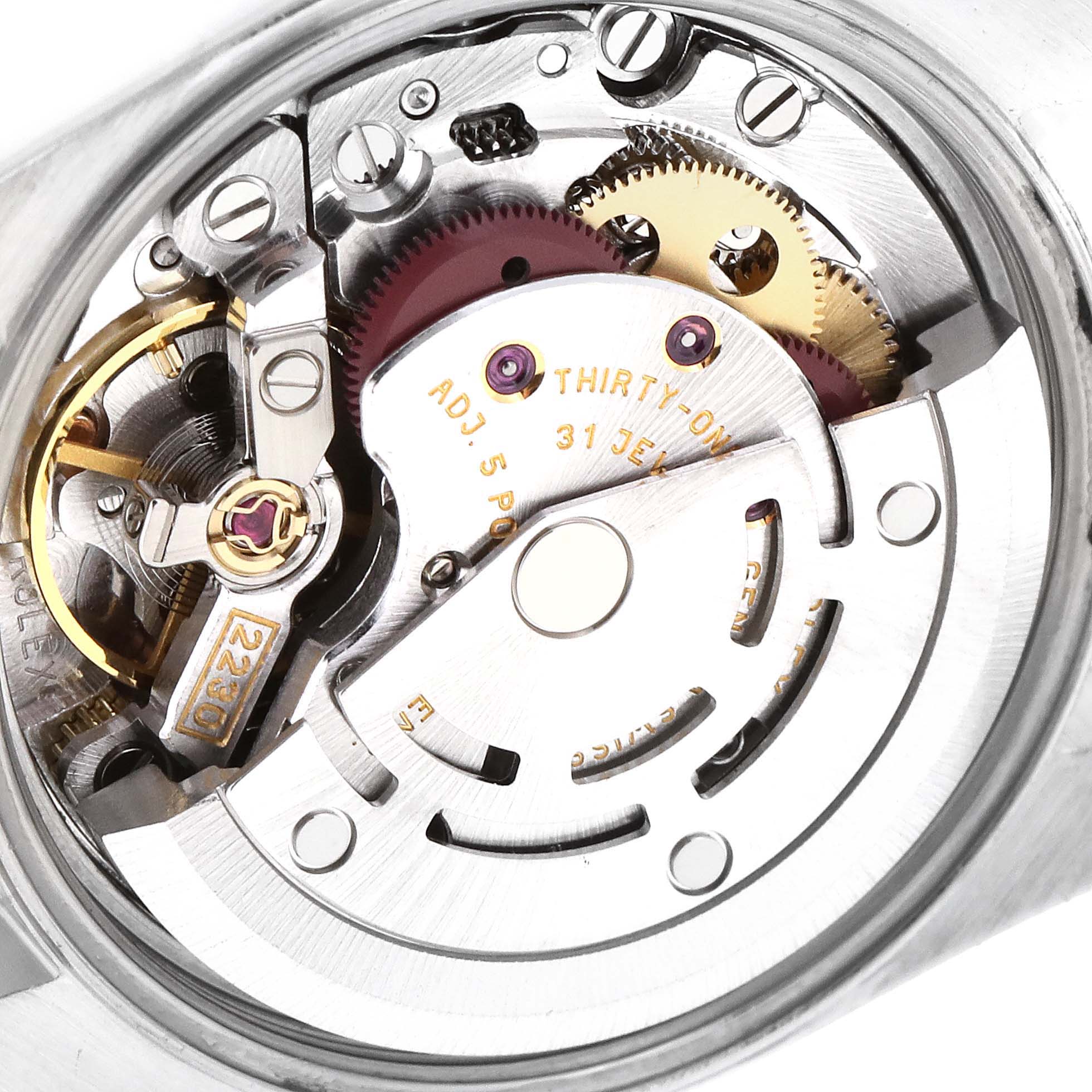This is a close-up view of the internal mechanism of a Rolex Oyster Perpetual 76080 Women
s Stainless Steel Pink Dial 76080 Women
s Stainless Steel Pink Dial watch, showcasing its intricate gears and components.