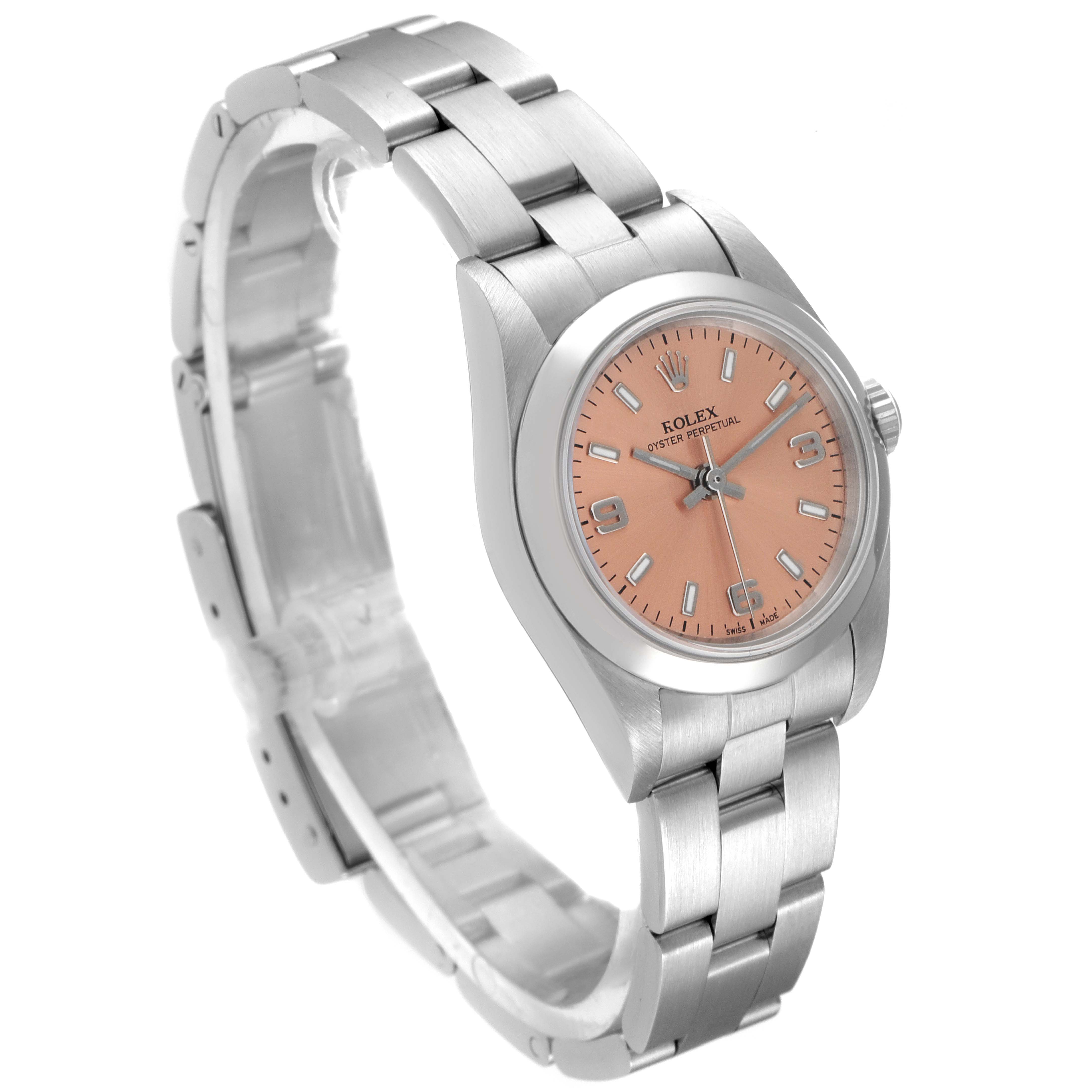 This image shows a Rolex Oyster Perpetual 76080 Women
s Stainless Steel Pink Dial 76080 Women
s Stainless Steel Pink Dial watch with a pink dial, viewed at an angle showcasing the face, case, and bracelet.